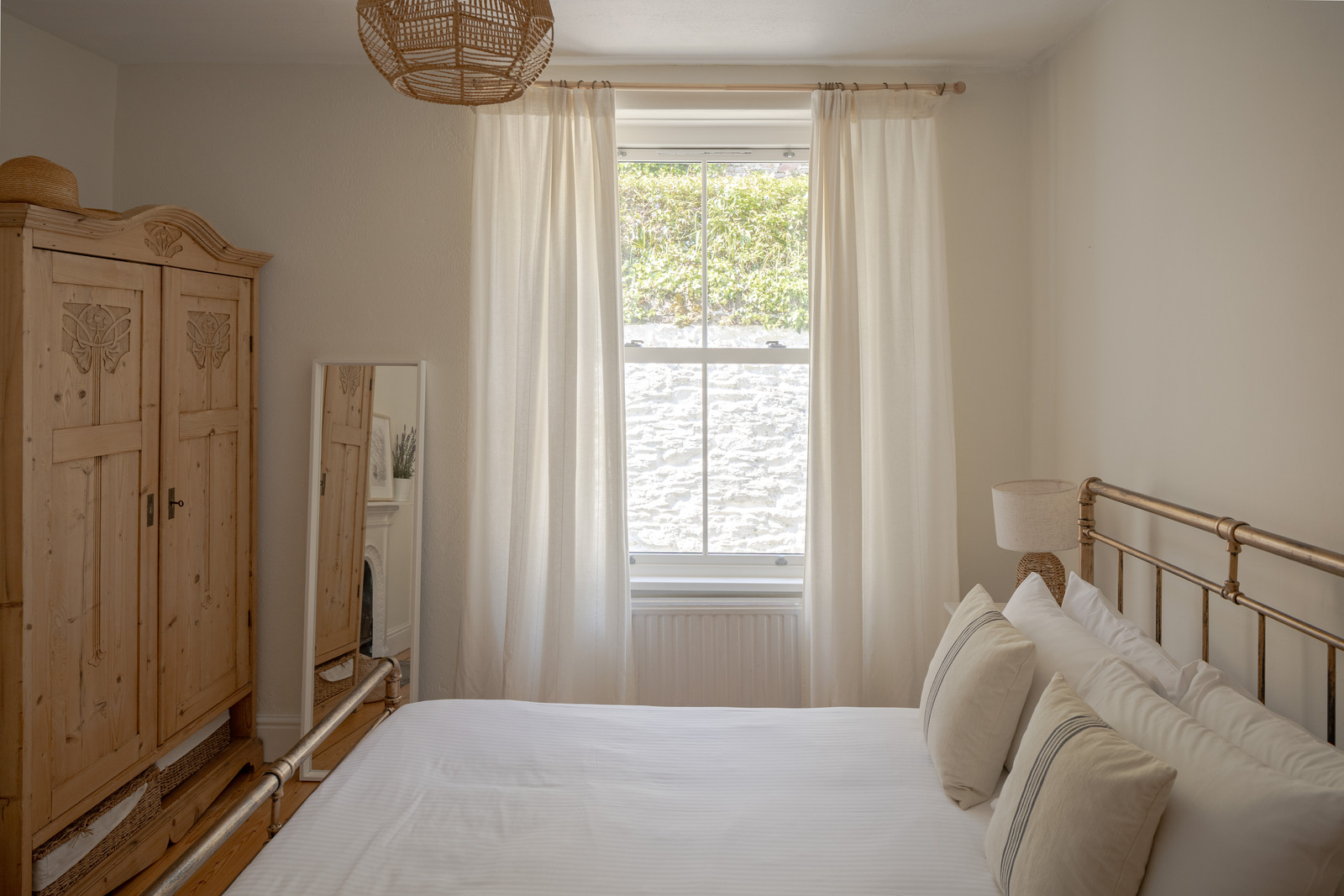 vintage bedroom with metal English bed terraced Victorian house near the sea