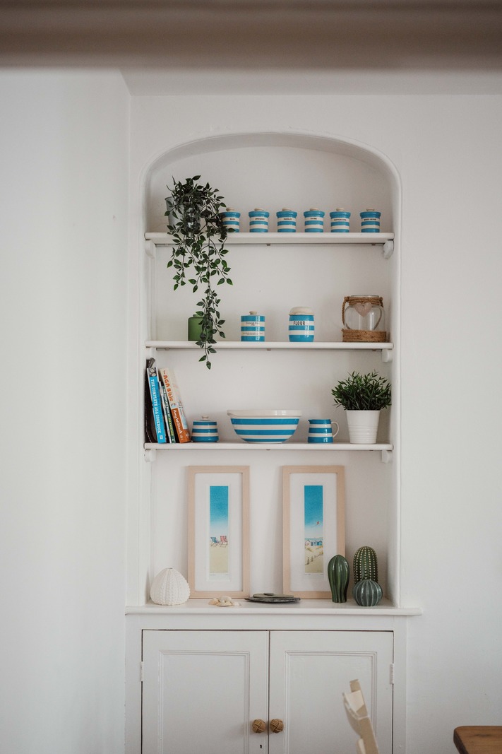 bookshelf in an arched niche
