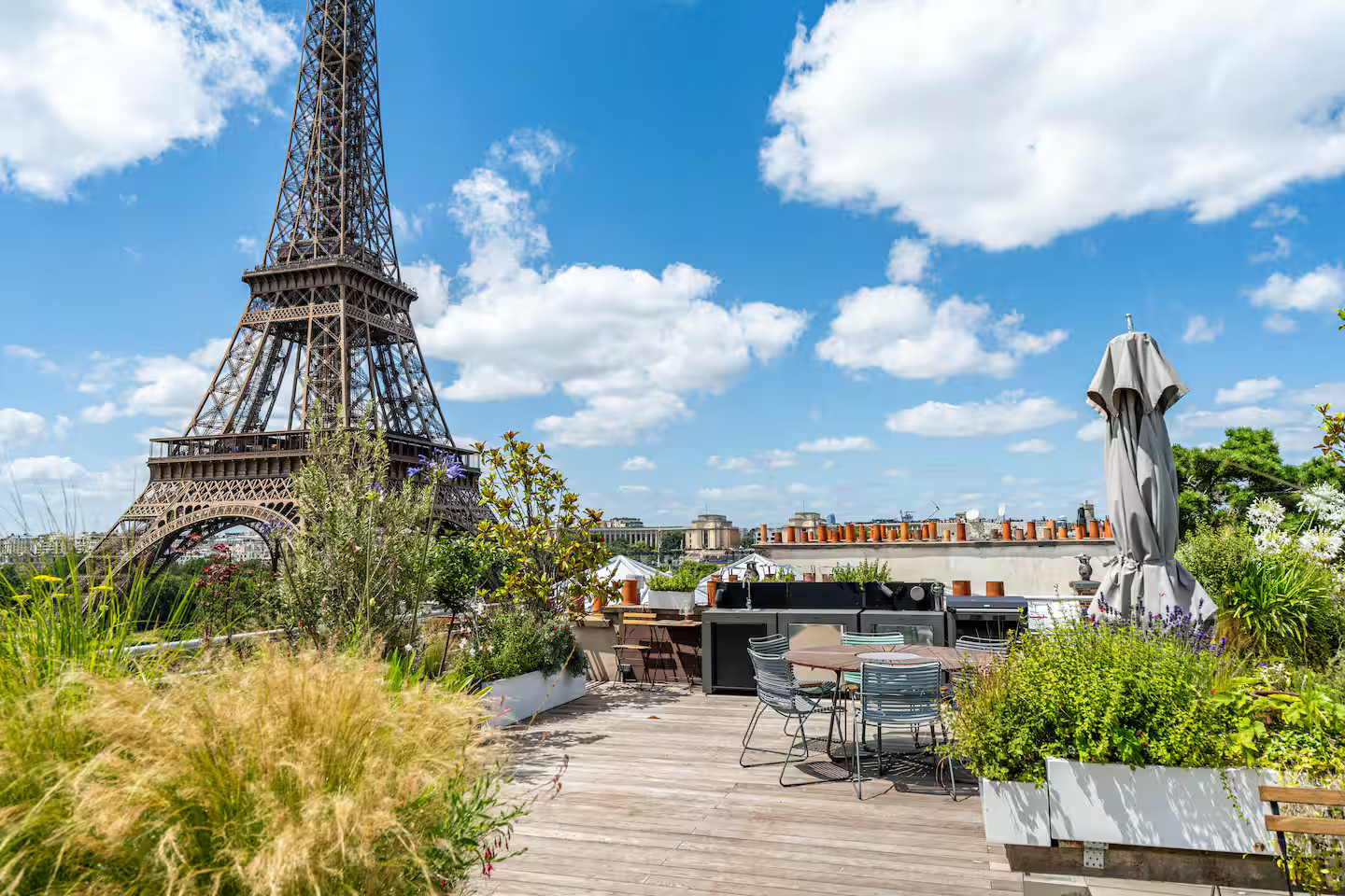 outdoor dining room on rooftop view on the Eiffel tower outdoor dining room on rooftop view on the Eiffel tower