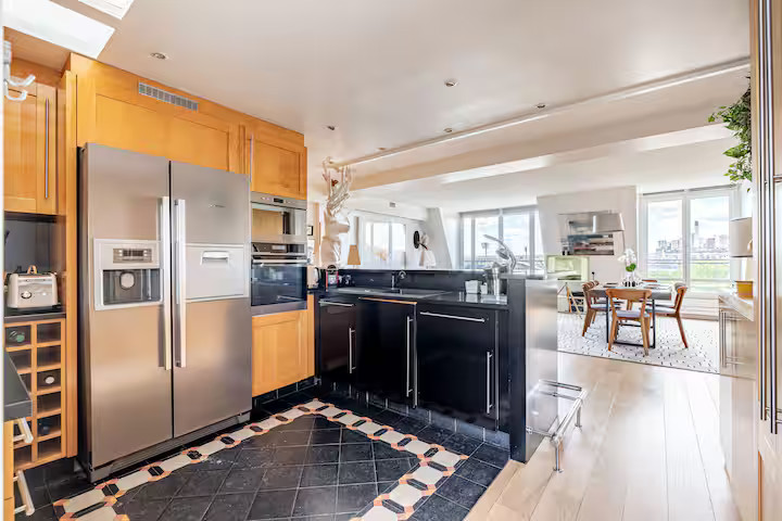 living room with open kitchen contemporary decor apartment Paris with rooftop and view on the Eiffel tower living room with open kitchen contemporary decor apartment Paris with rooftop and view on the Eiffel tower