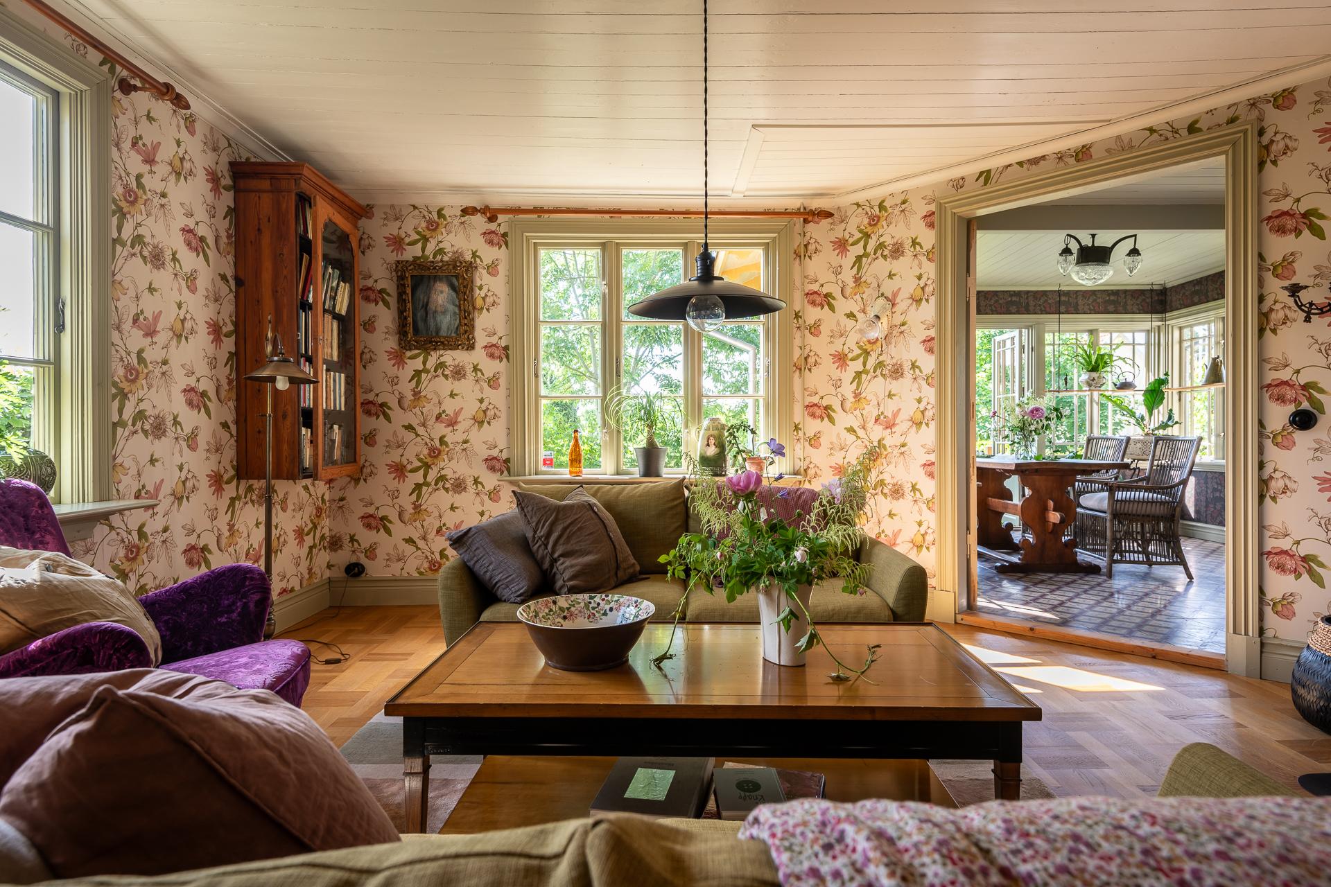 living room with floral wallpaper scandinavian decor