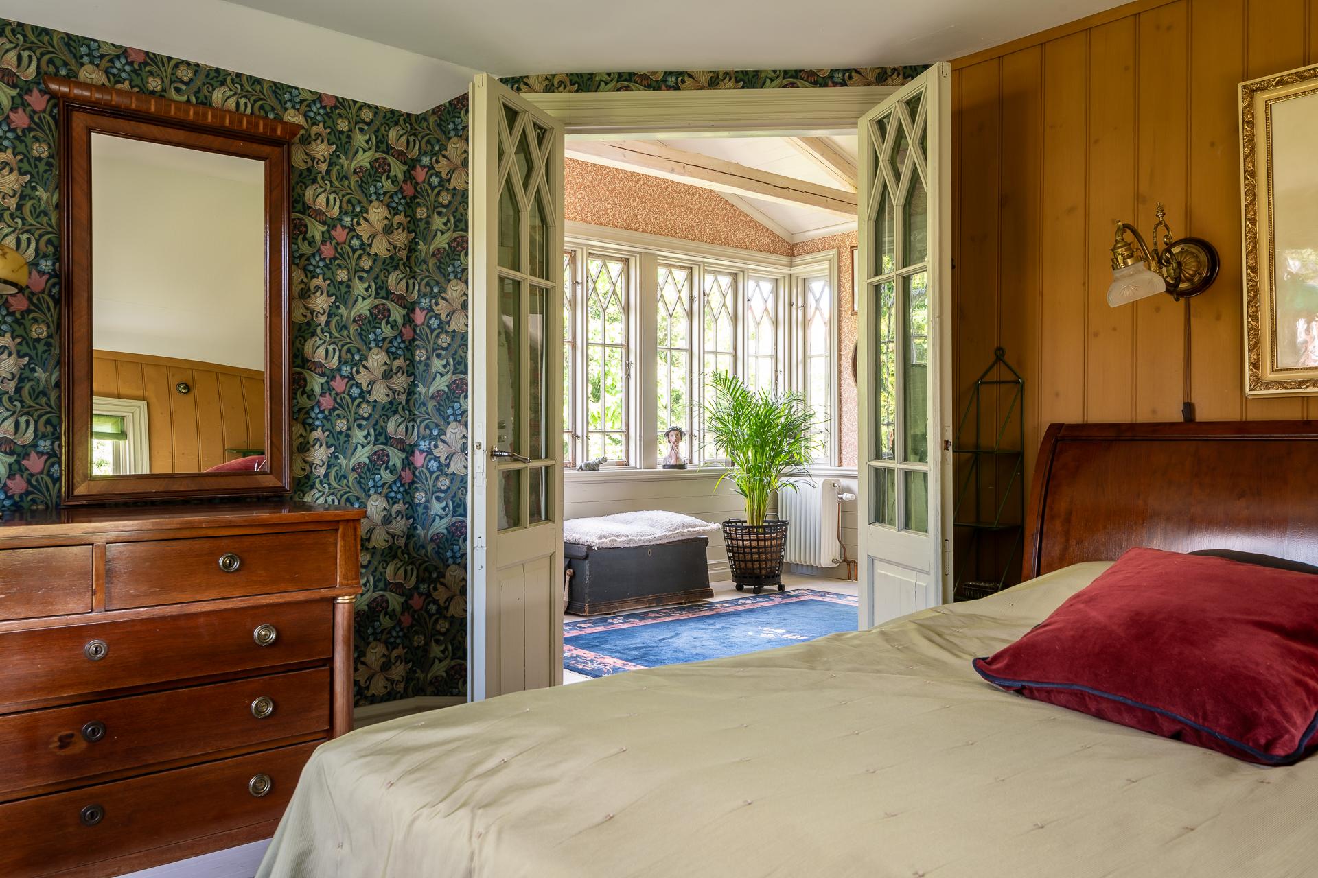 bedroom with floral wallpaper vintage and scandinavian decor