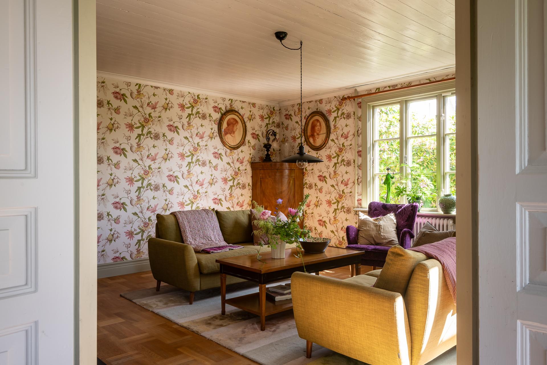 living room with floral wallpaper scandinavian decor