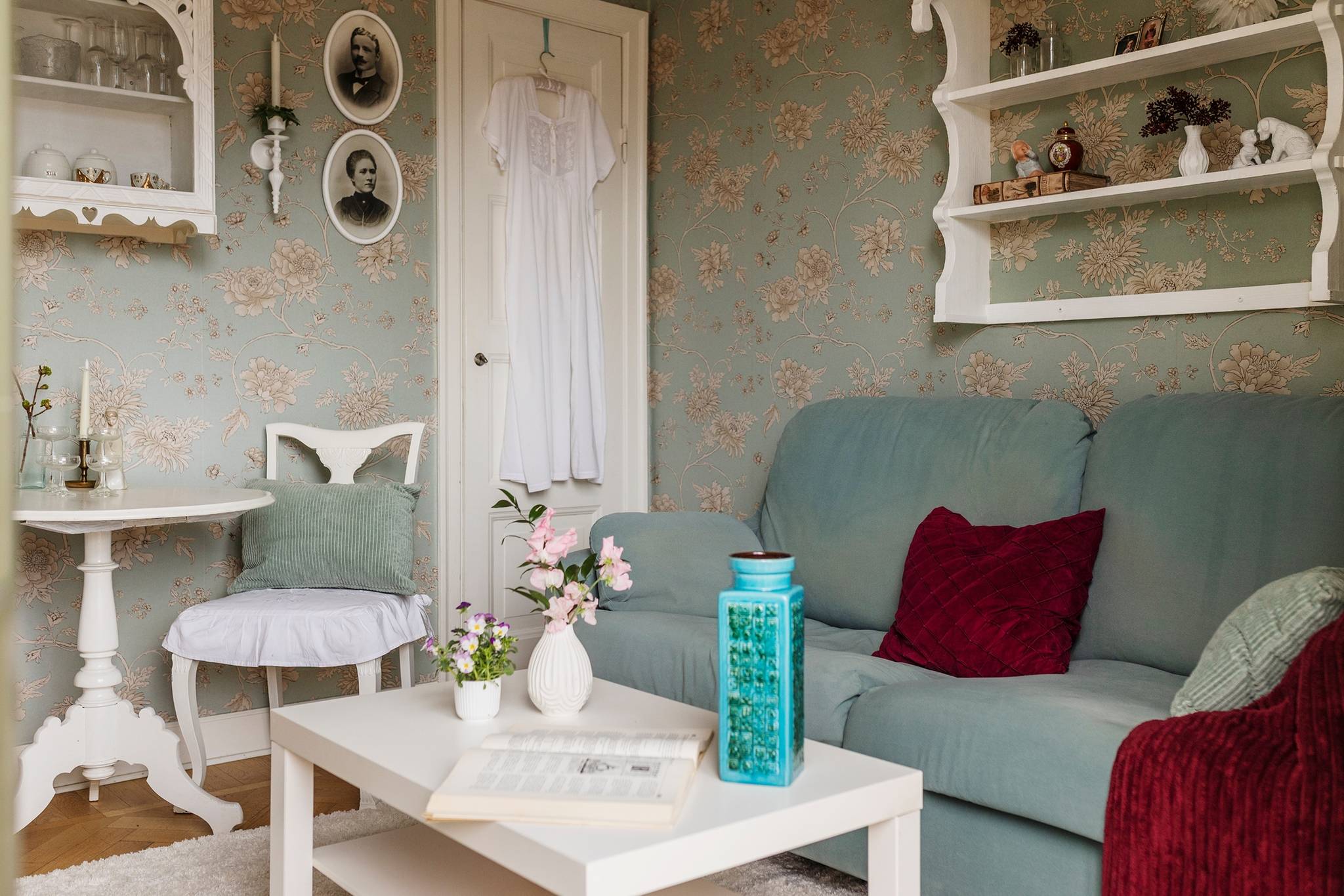 living room with floral wallpaper and blue sofa 30sqm apartment scandinavian decor country chic style living room with floral wallpaper and blue sofa 30sqm apartment scandinavian decor country chic style
