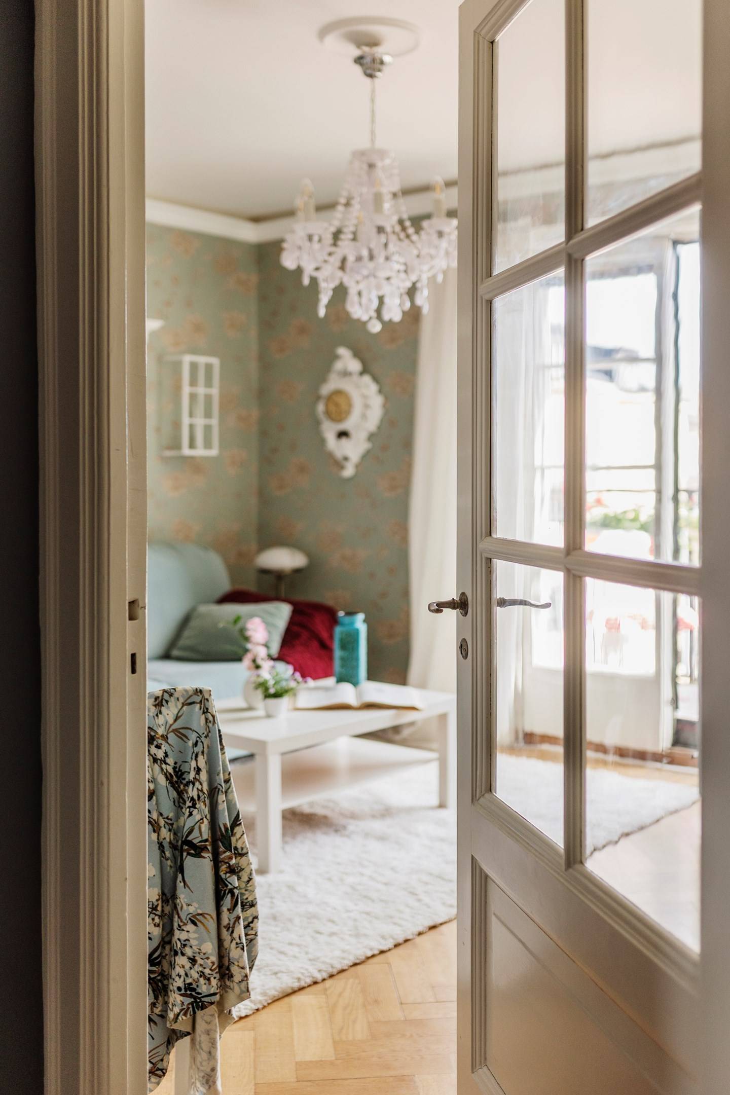 living room with floral wallpaper and blue sofa 30sqm apartment scandinavian decor country chic style living room with floral wallpaper and blue sofa 30sqm apartment scandinavian decor country chic style