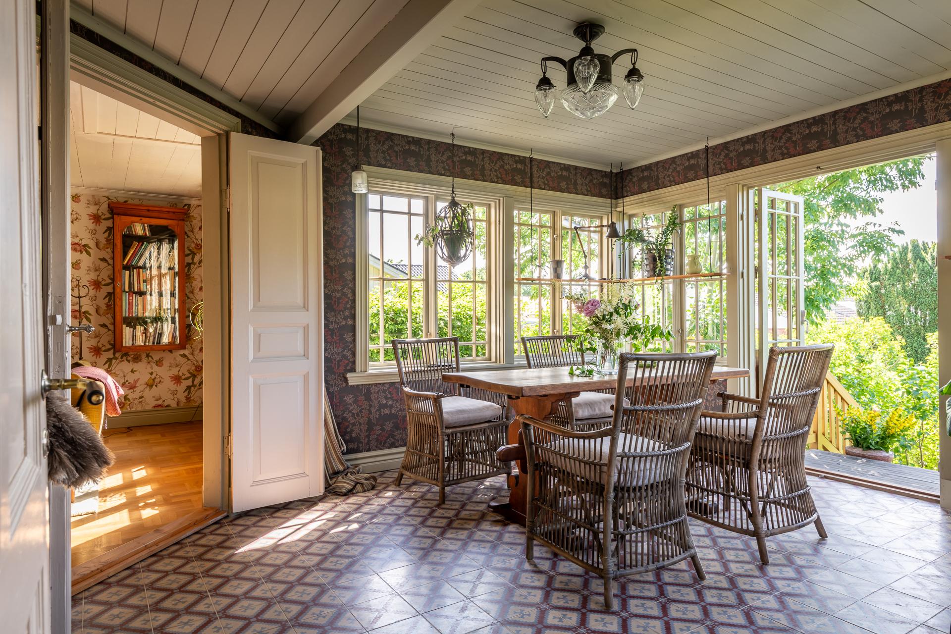 dining room in veranda with Marrakech artisanal cement tiles scandinavian decor