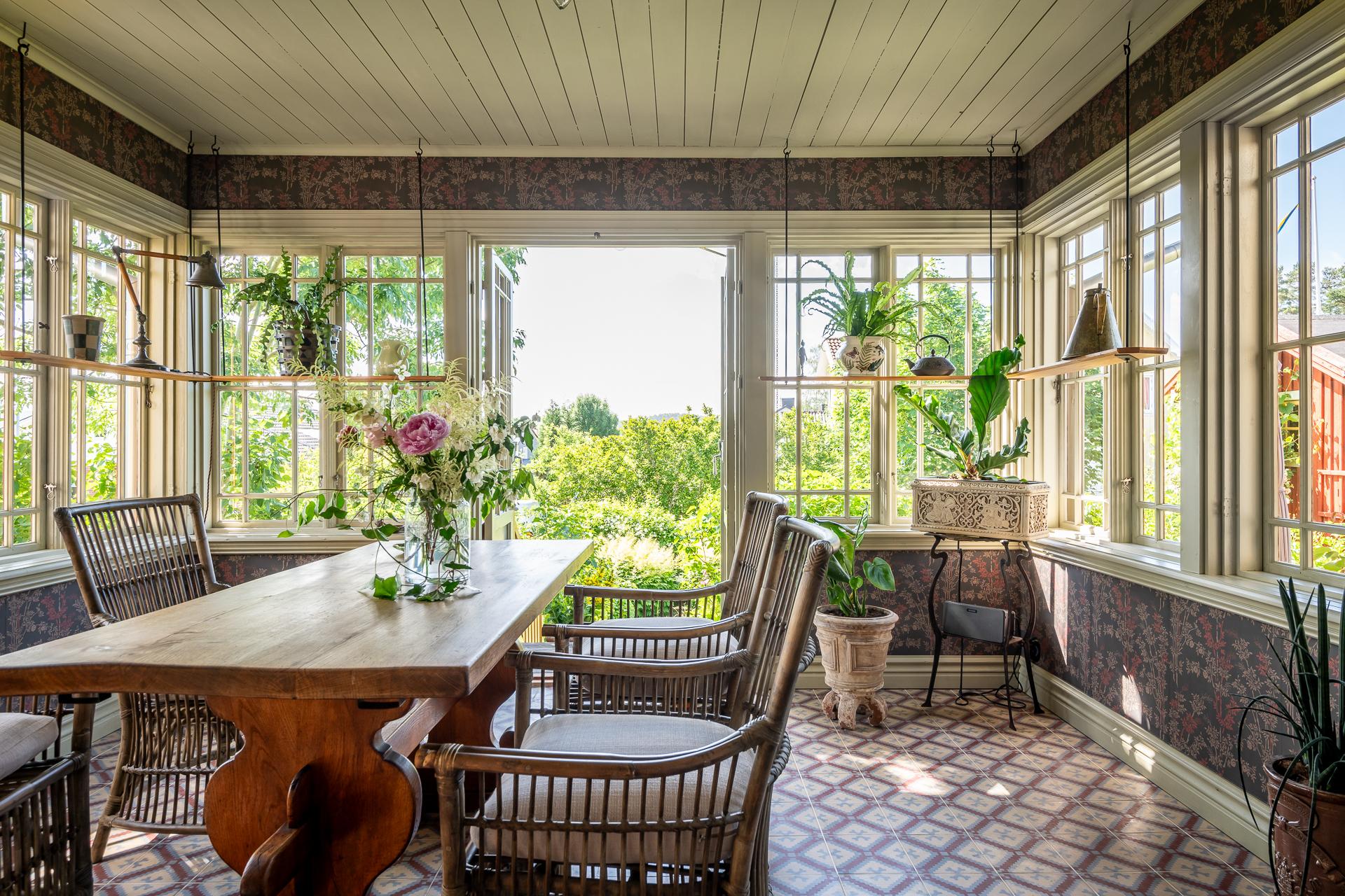 dining room in veranda with Marrakech artisanal cement tiles scandinavian decor