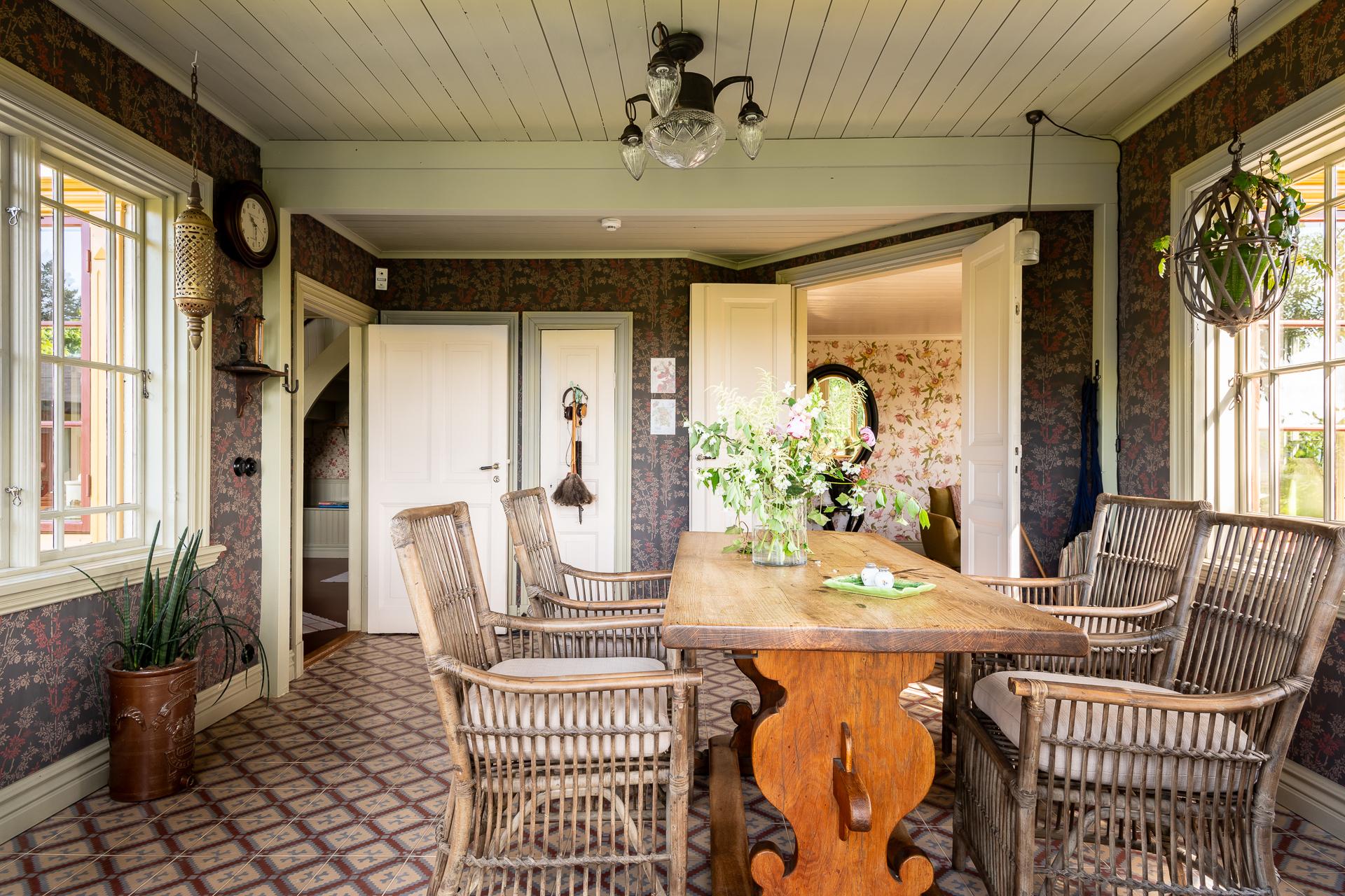 dining room in veranda with Marrakech artisanal cement tiles scandinavian decor