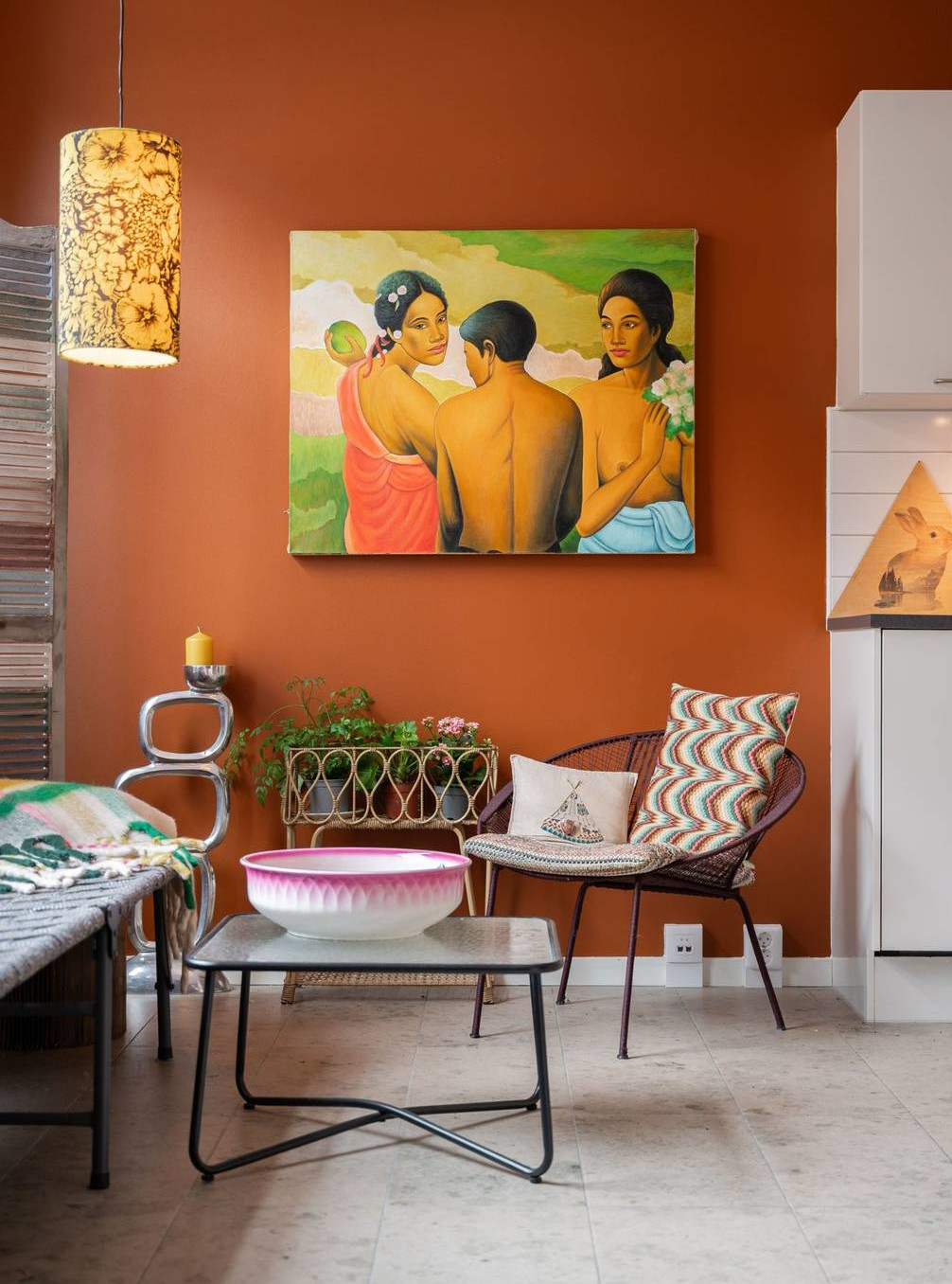 living room maximalist decor terracotta walls and white open kitchen