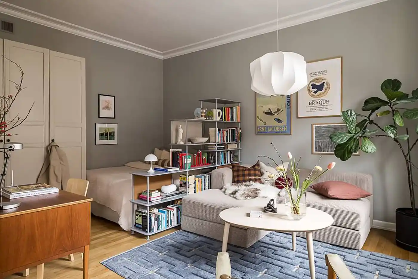 bed space behind a bookshelve in a studio bed space behind a bookshelve in a studio