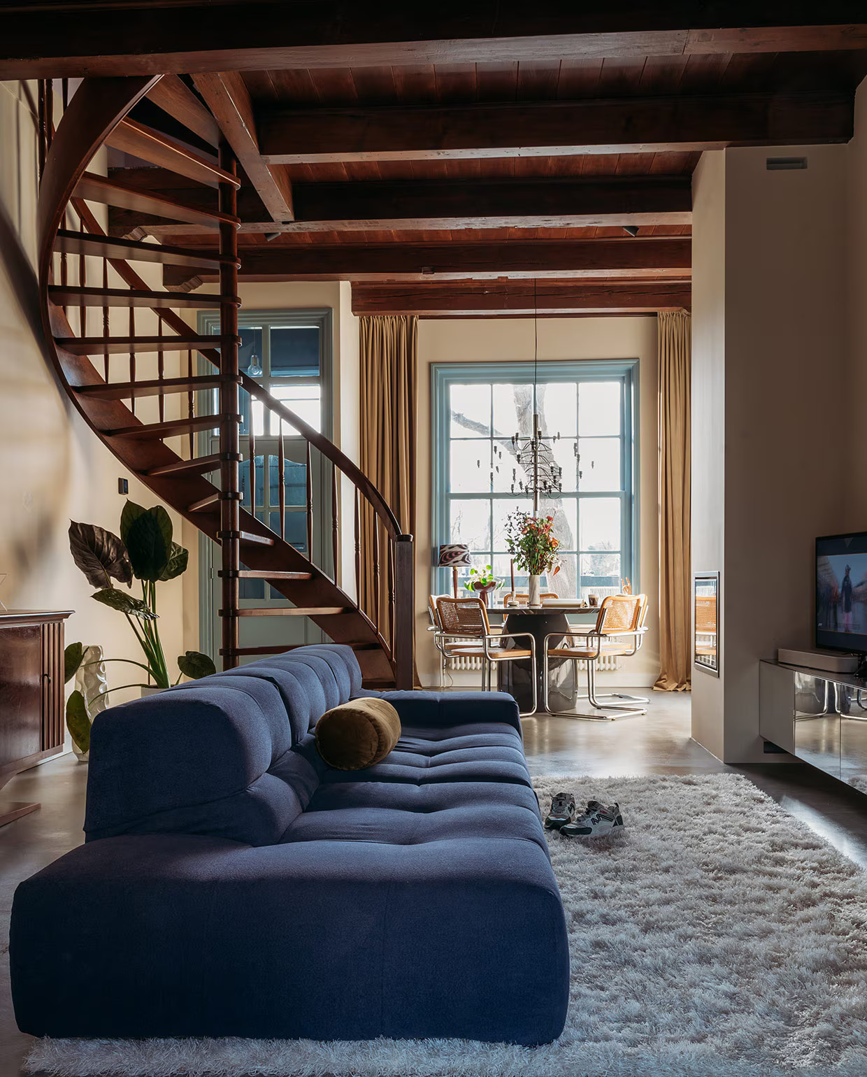 living room with stunning wooden staircase and blue sofa contemporary decor living room with stunning wooden staircase and blue sofa contemporary decor