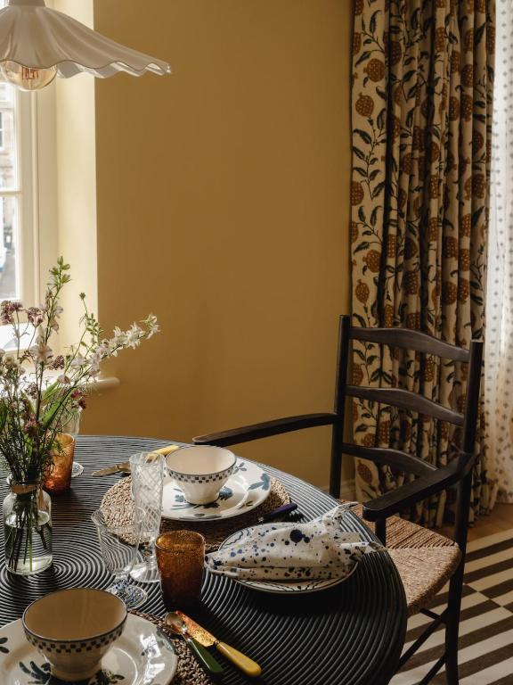dining room butter yellow walls charming 56sqm apartment in Cotswolds classic chic decor