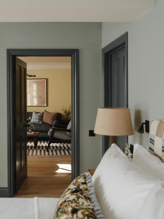 bedroom light green walls charming 56sqm apartment in Cotswolds classic chic decor
