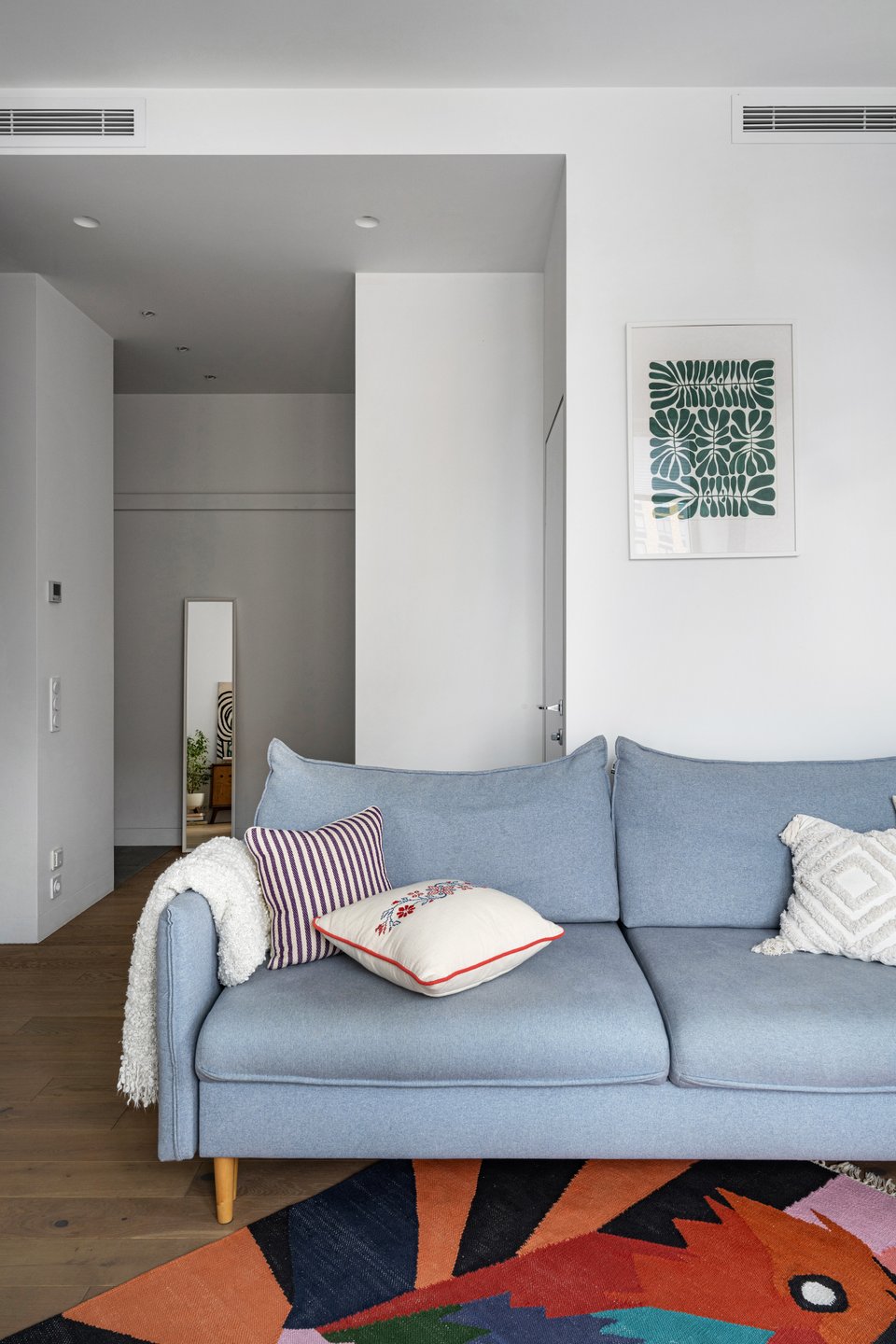 living room with coloured rug contemporary decor 50sqm apartment of a designer