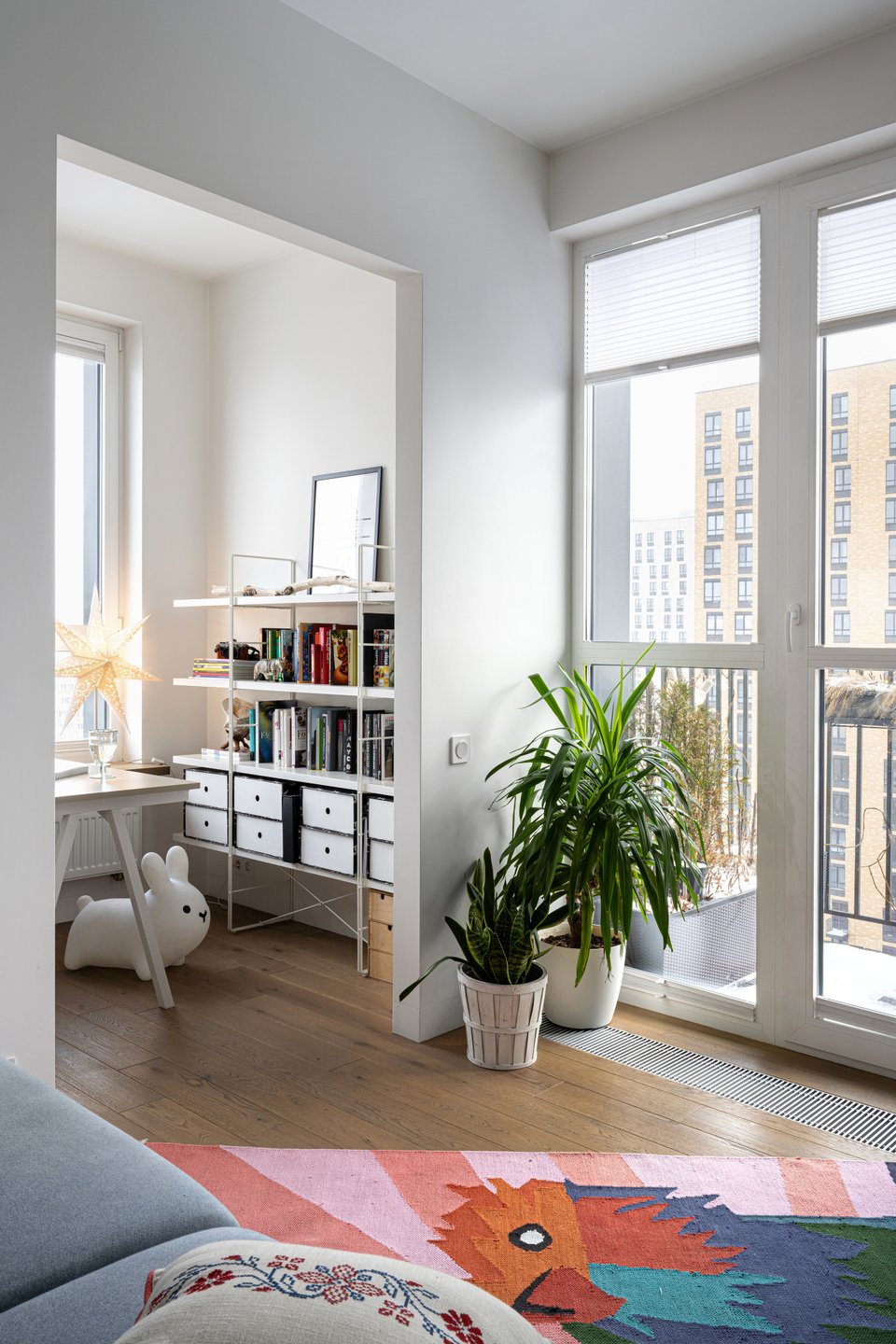 home office and living room with coloured rug contemporary decor 50sqm apartment of a designer