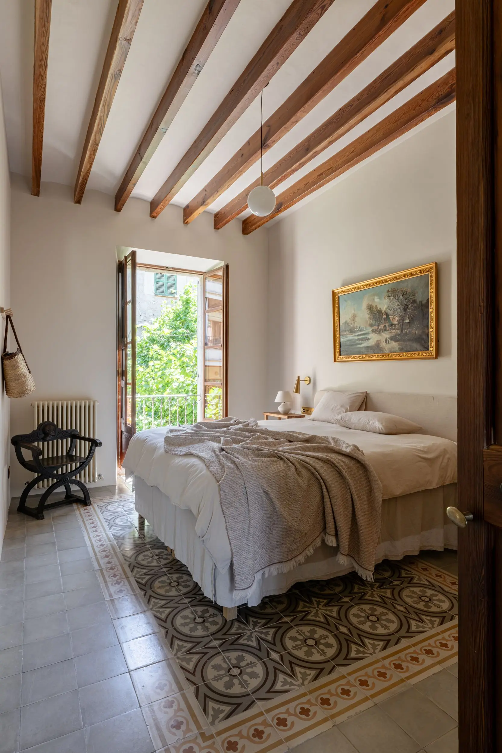 bedroom with old tiles and beams townhouse in Mallorca with pool Sa Casona by Berrow bedroom with old tiles and beams townhouse in Mallorca with pool Sa Casona by Berrow