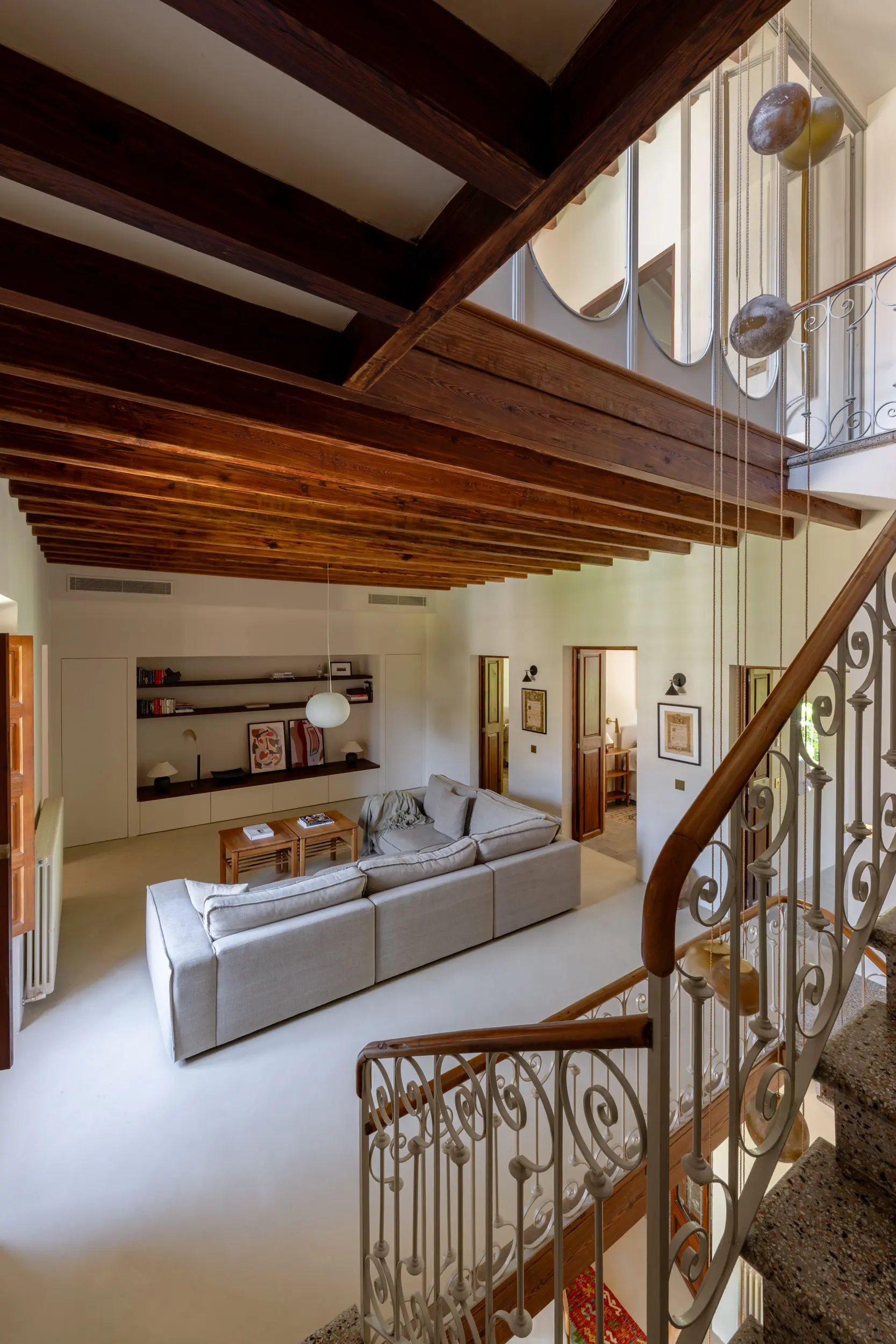 living room with stairs and beams designer decor townhouse in Mallorca with pool Sa Casona by Berrow living room with stairs and beams designer decor townhouse in Mallorca with pool Sa Casona by Berrow