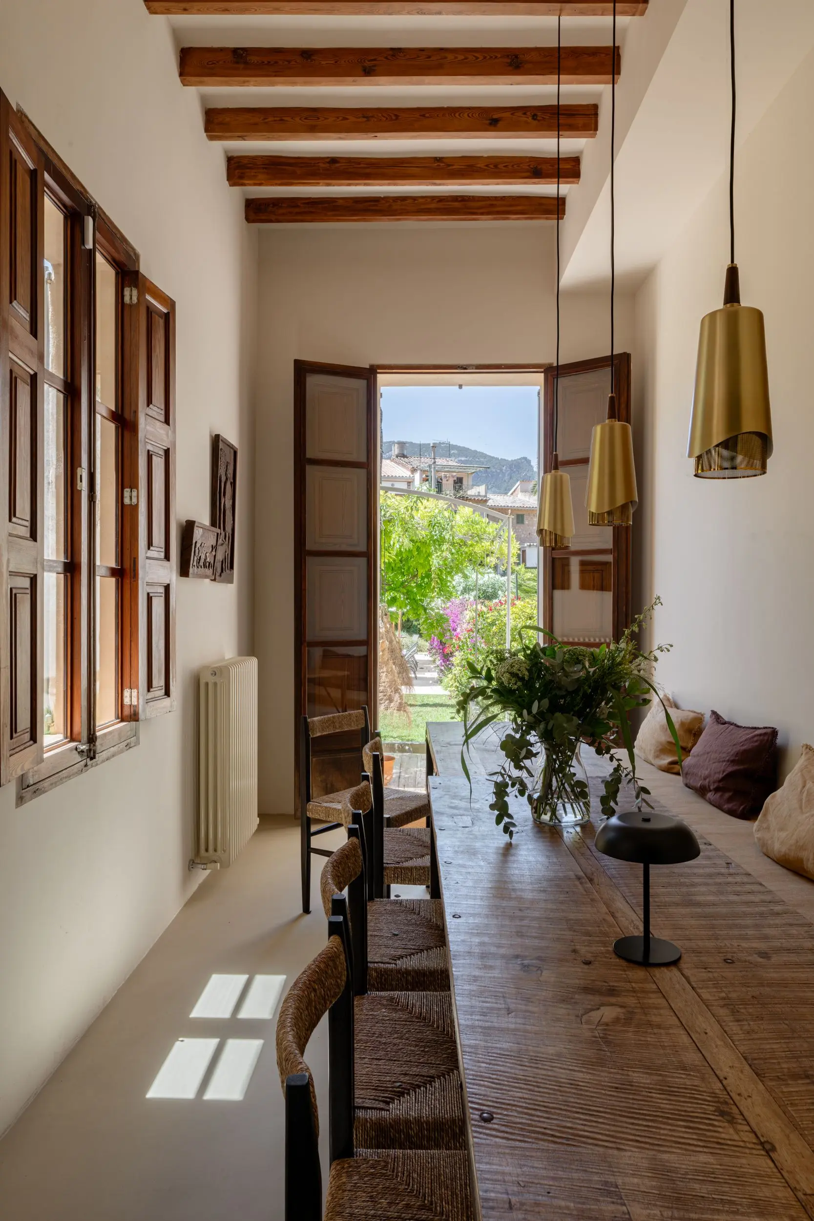 dining room with beams and French doors townhouse in Mallorca with pool Sa Casona by Berrow dining room with beams and French doors townhouse in Mallorca with pool Sa Casona by Berrow