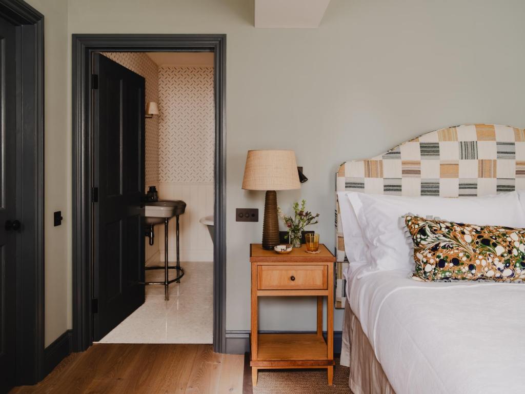 bedroom light green walls charming 56sqm apartment in Cotswolds classic chic decor