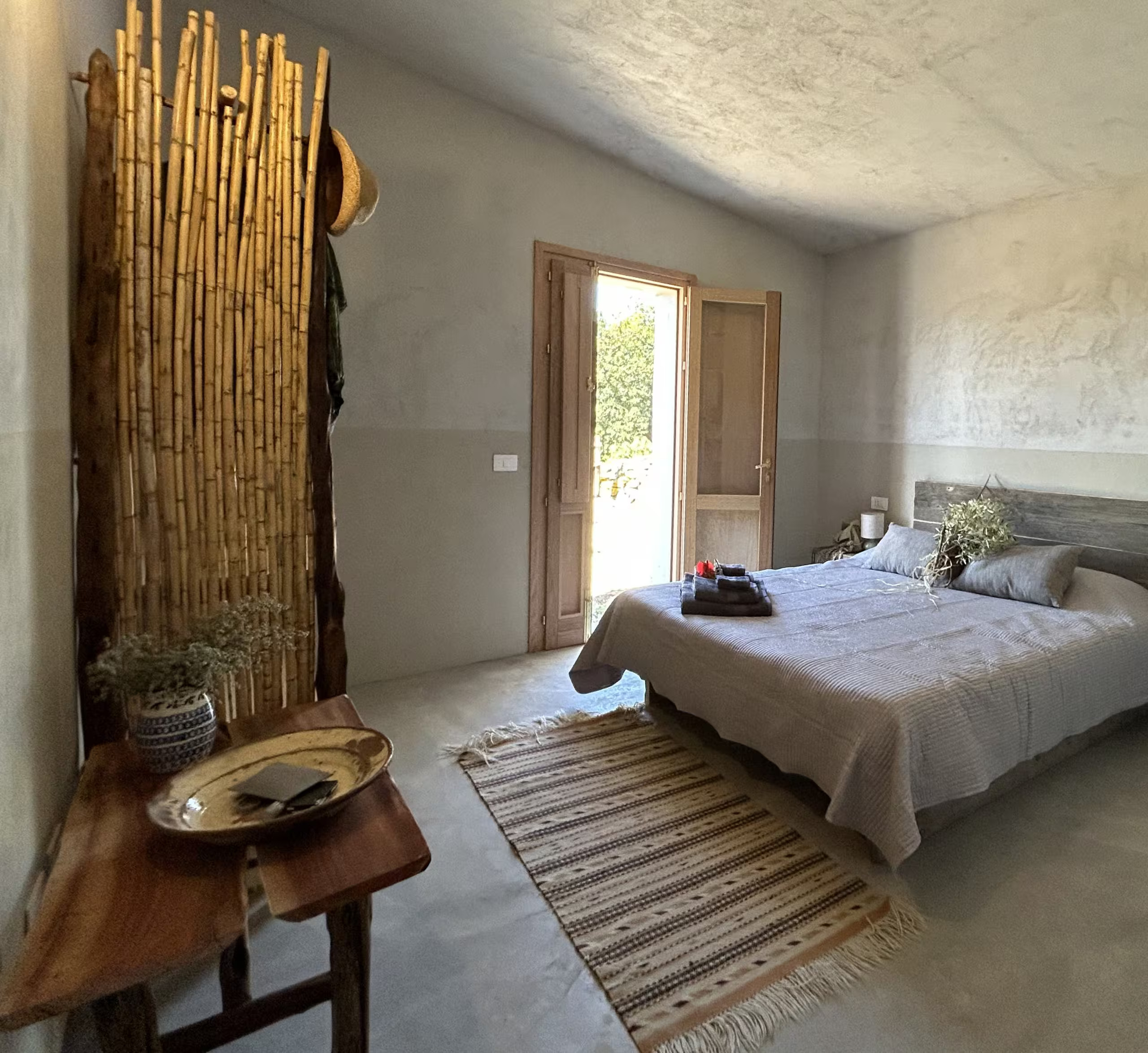 gray bedroom in Sardinia home