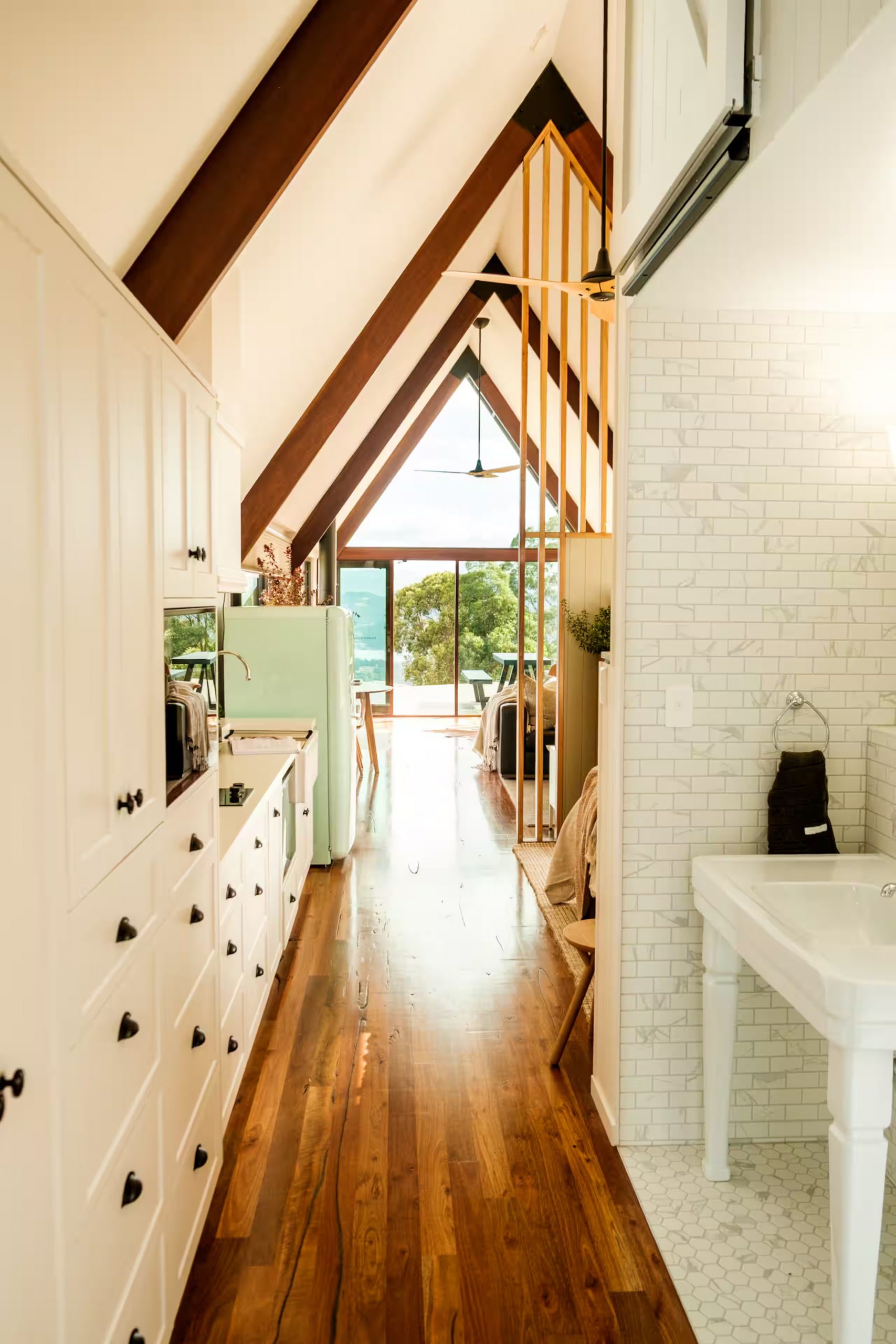 open kitchen living room off-grid wooden A-Frame house in Tasmania open kitchen living room off-grid wooden A-Frame house in Tasmania