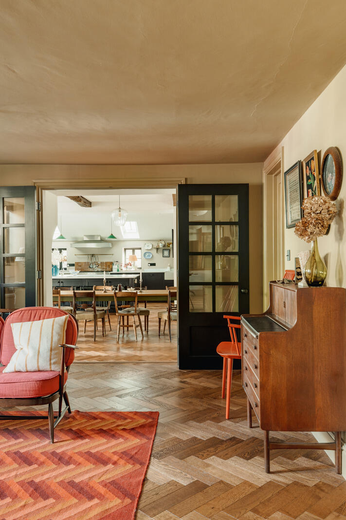 large kitchen with dining room and living room classic chic decor Tudor-style village house large kitchen with dining room and living room classic chic decor Tudor-style village house