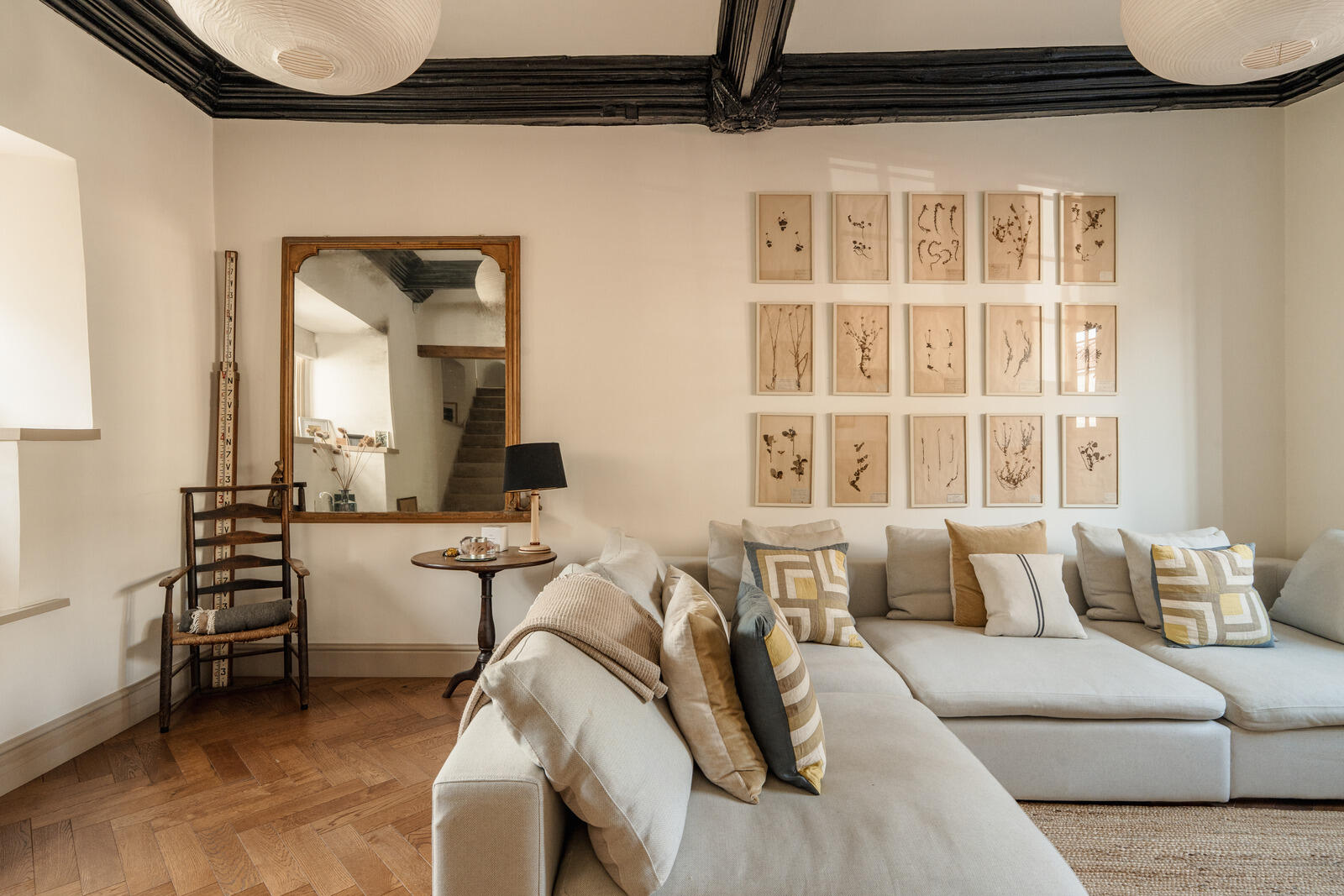 beige living room with fireplace and beams classic chic decor Tudor-style village house beige living room with fireplace and beams classic chic decor Tudor-style village house