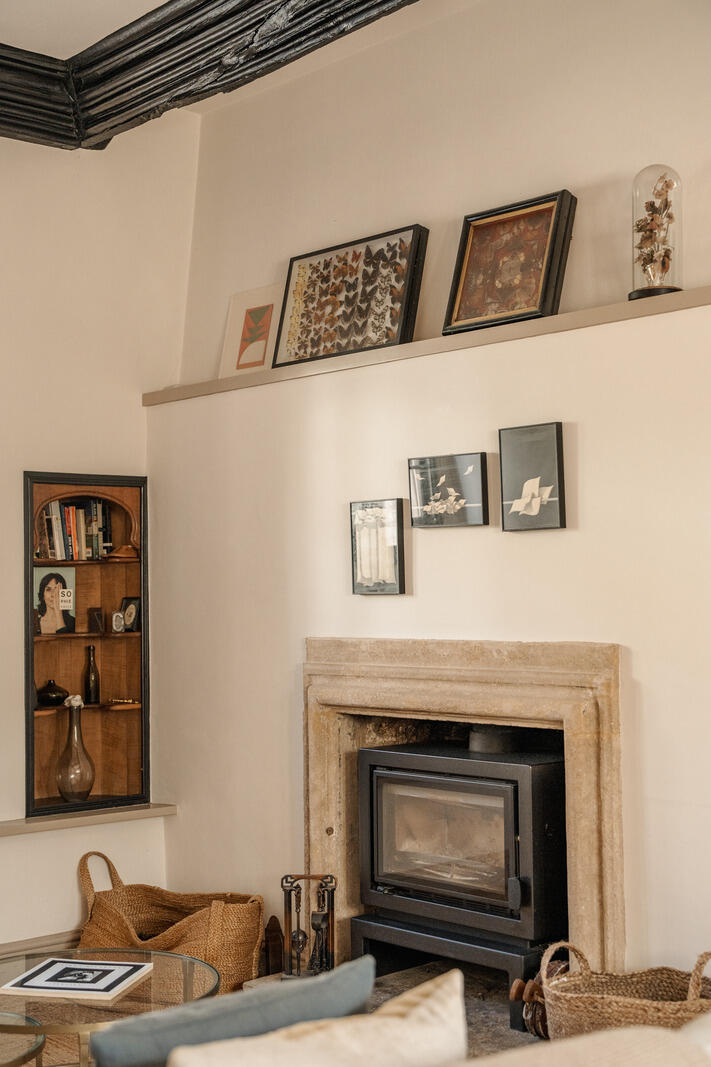 beige living room with fireplace and beams classic chic decor Tudor-style village house beige living room with fireplace and beams classic chic decor Tudor-style village house