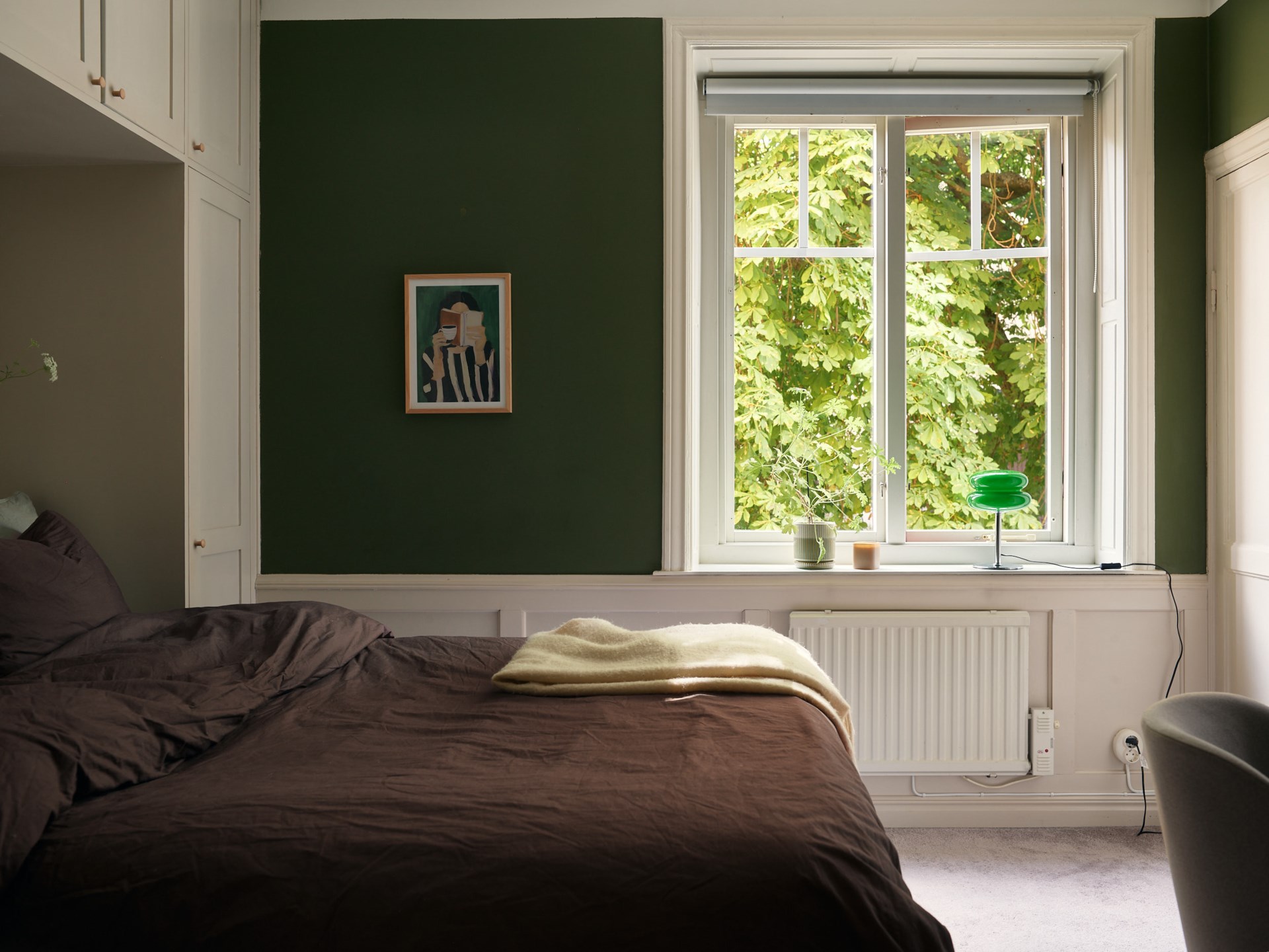 bedroom with bridge-style cabinet green walls 58sqm apartment Scandinavian decor