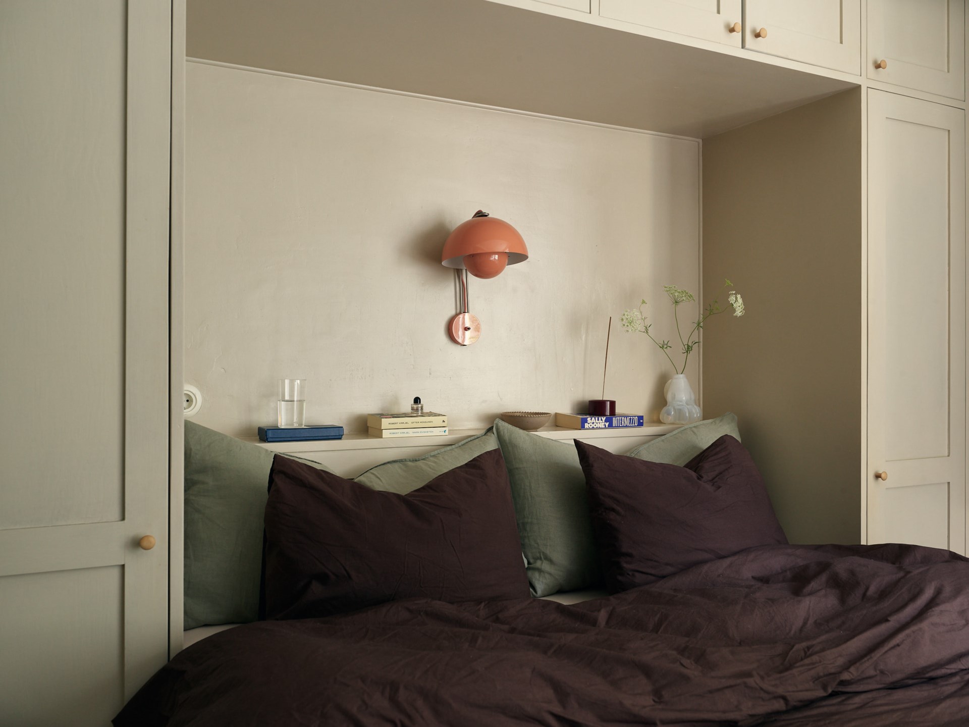 bedroom with bridge-style cabinet green walls 58sqm apartment Scandinavian decor