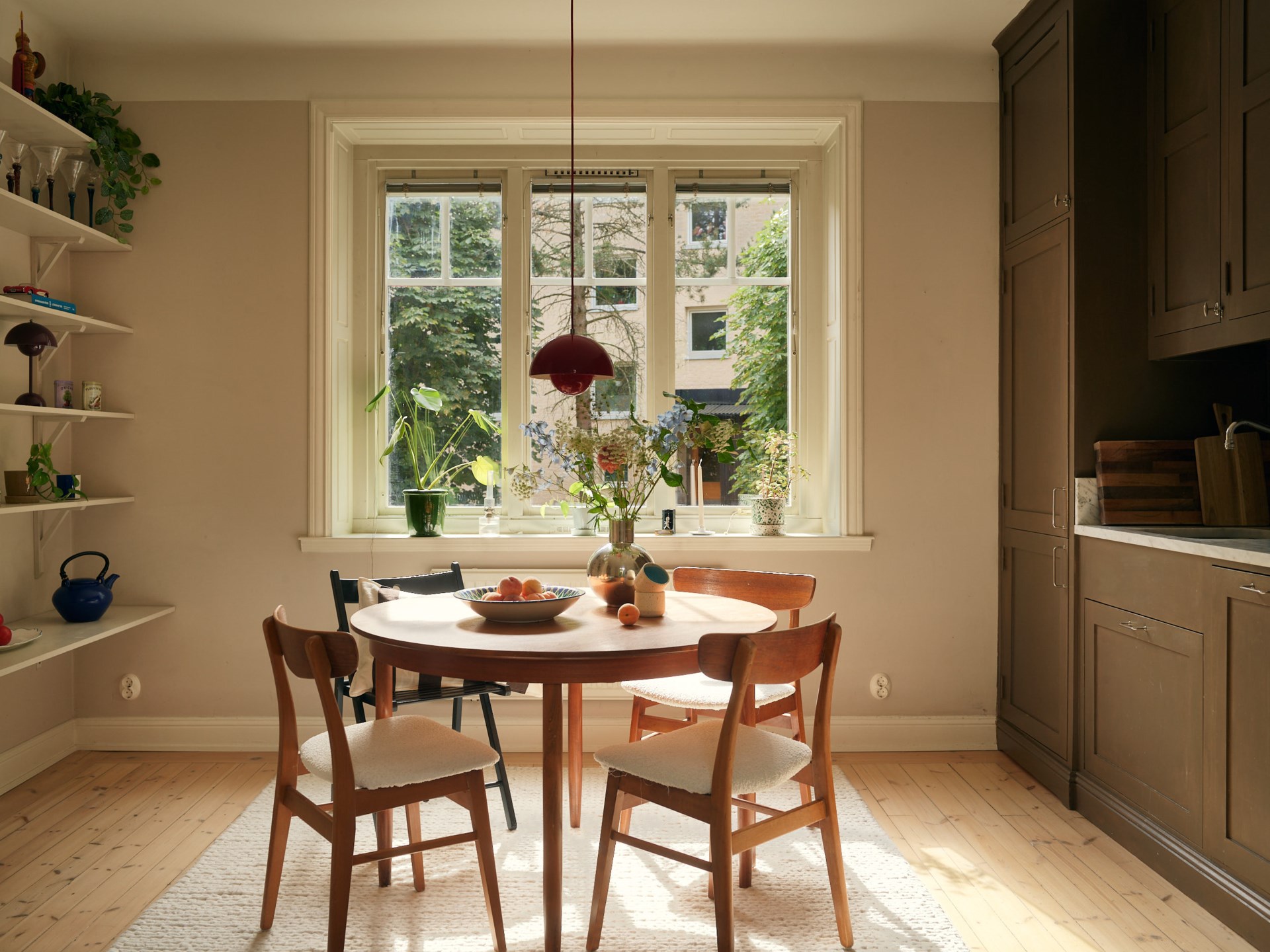 brown shaker kitchen with dining room in a 58sqm apartment Scandinavian decor