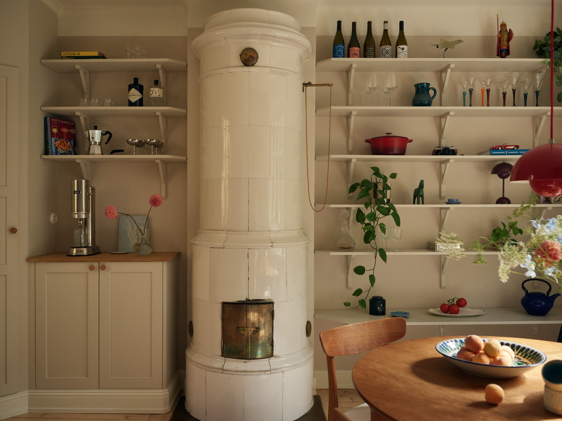 dining room and historic stove in a 58sqm apartment Scandinavian decor