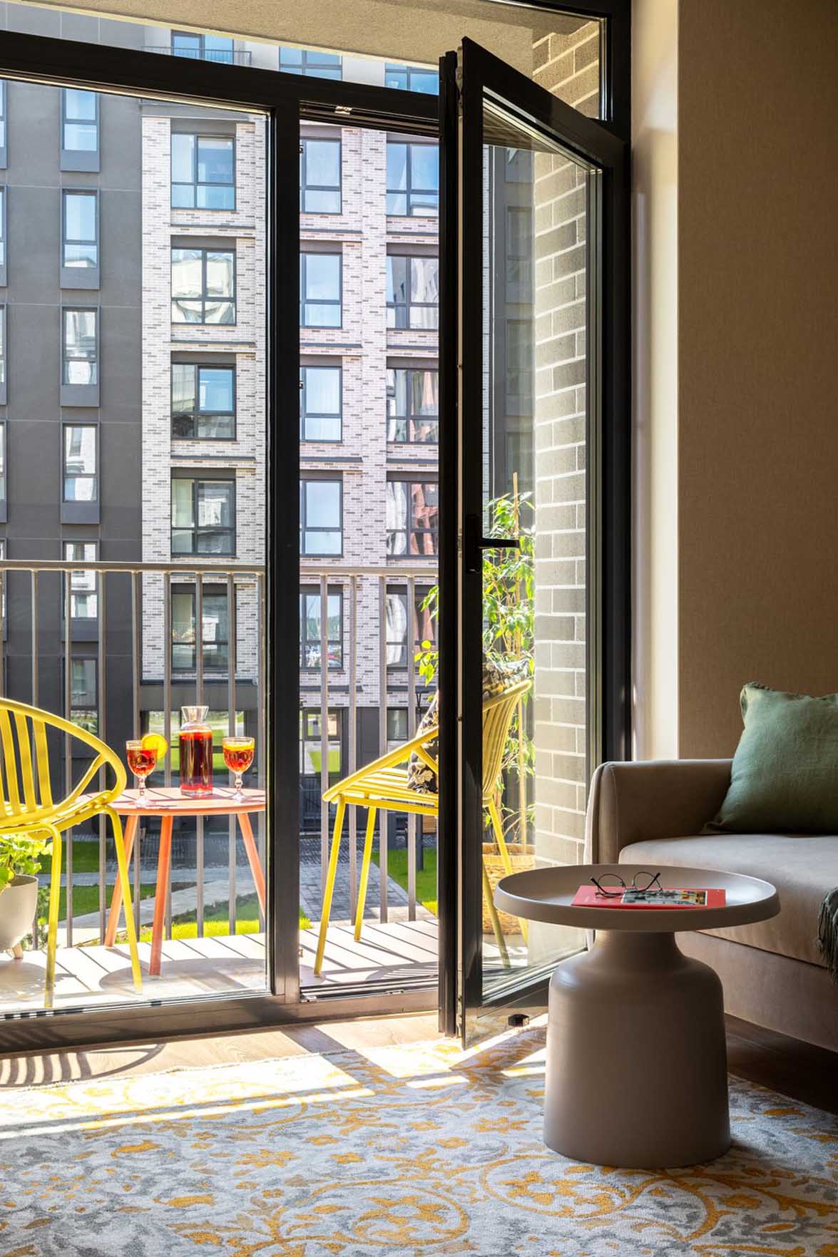 living room and balcony gray sofa bay window contemporary decor 38sqm apartment