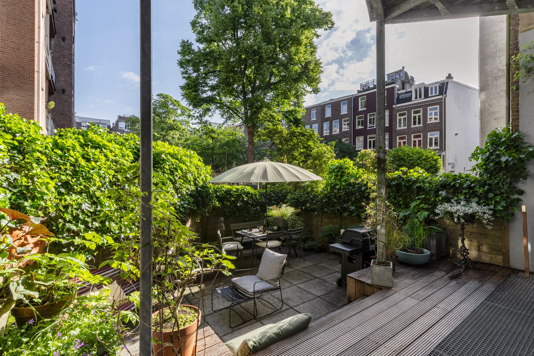 small town garden with wooden terrace
