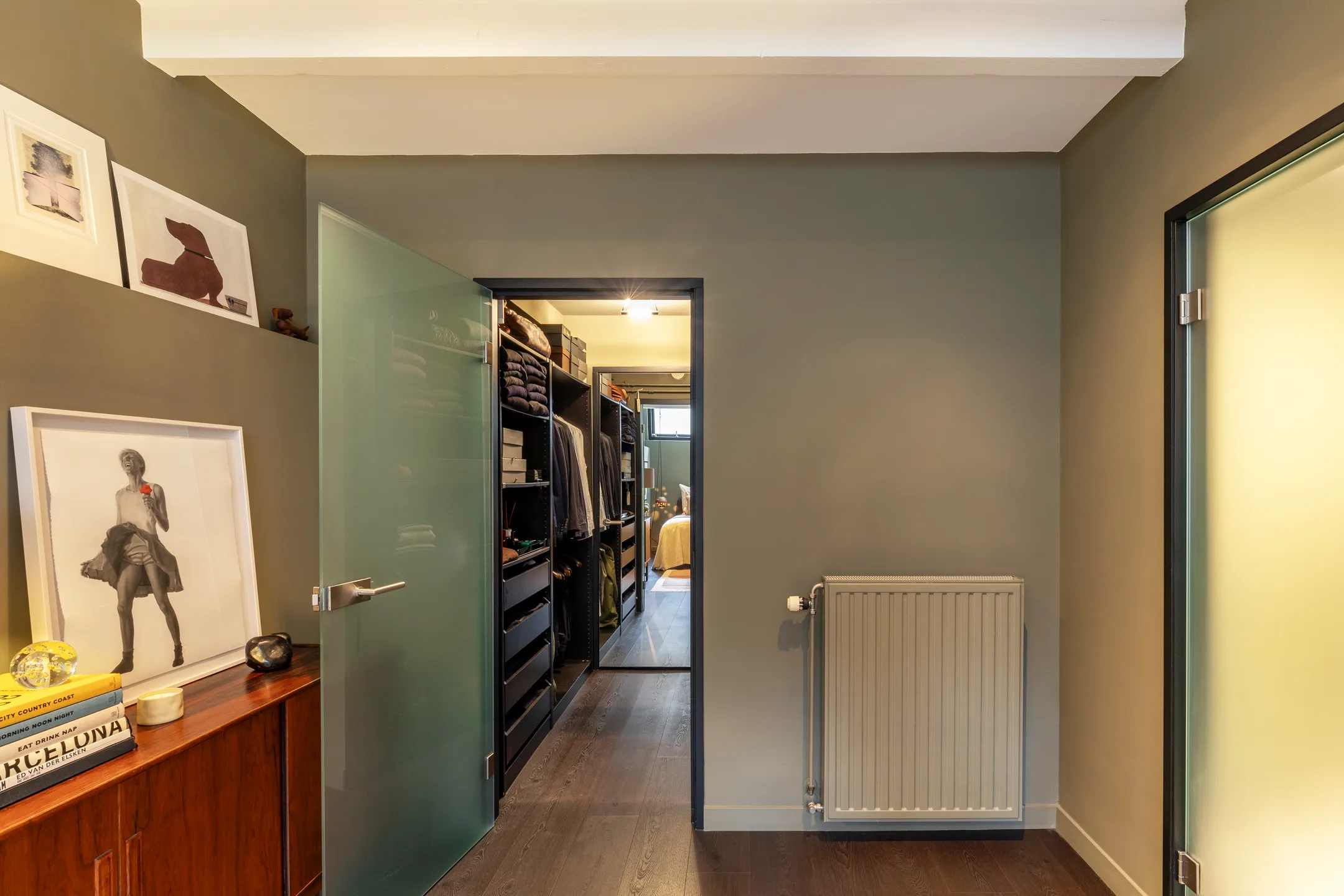 bedroom with green walls in the basement 191sqm duplex apartment contemporary decor Amsterdam