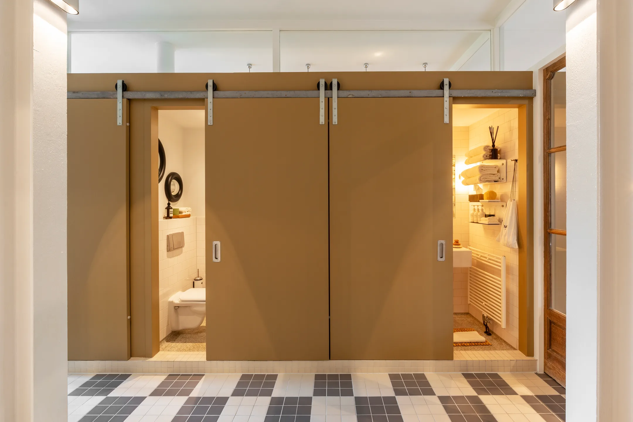 hallway with chekered floor 191sqm duplex apartment contemporary decor Amsterdam