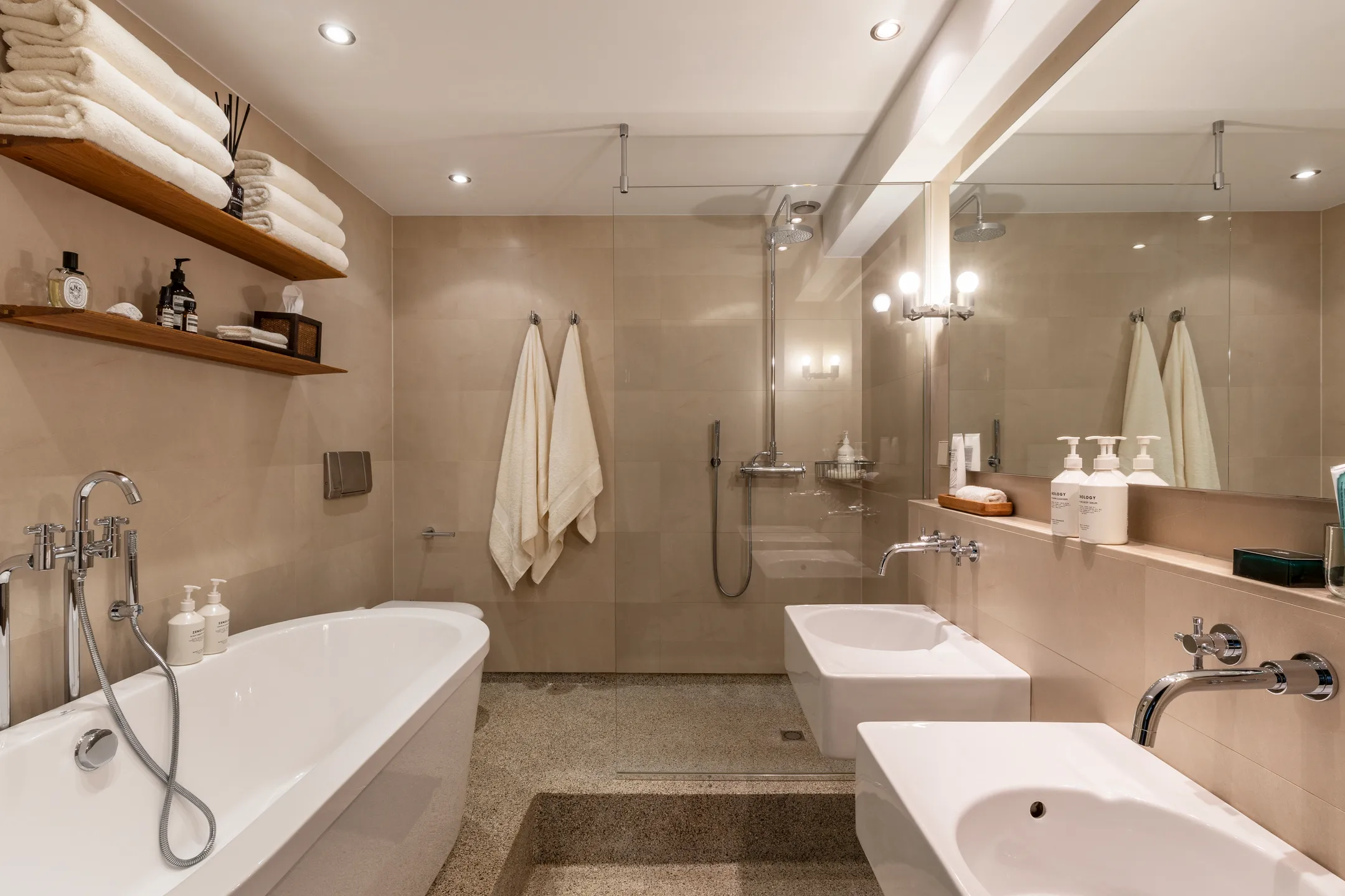 modern bathroom with island bathtub and terrazzo floor