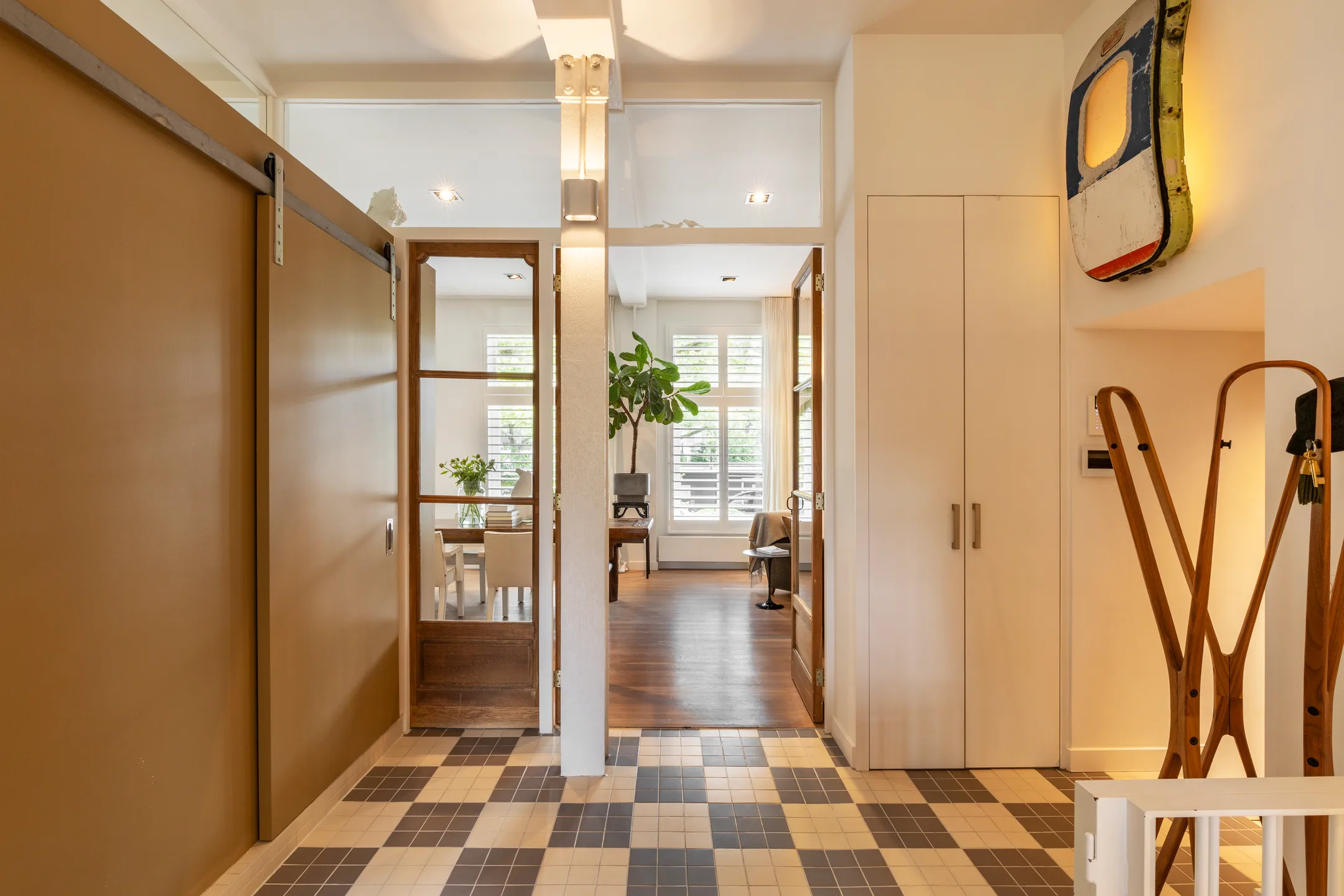 hallway with chekered floor 191sqm duplex apartment contemporary decor Amsterdam