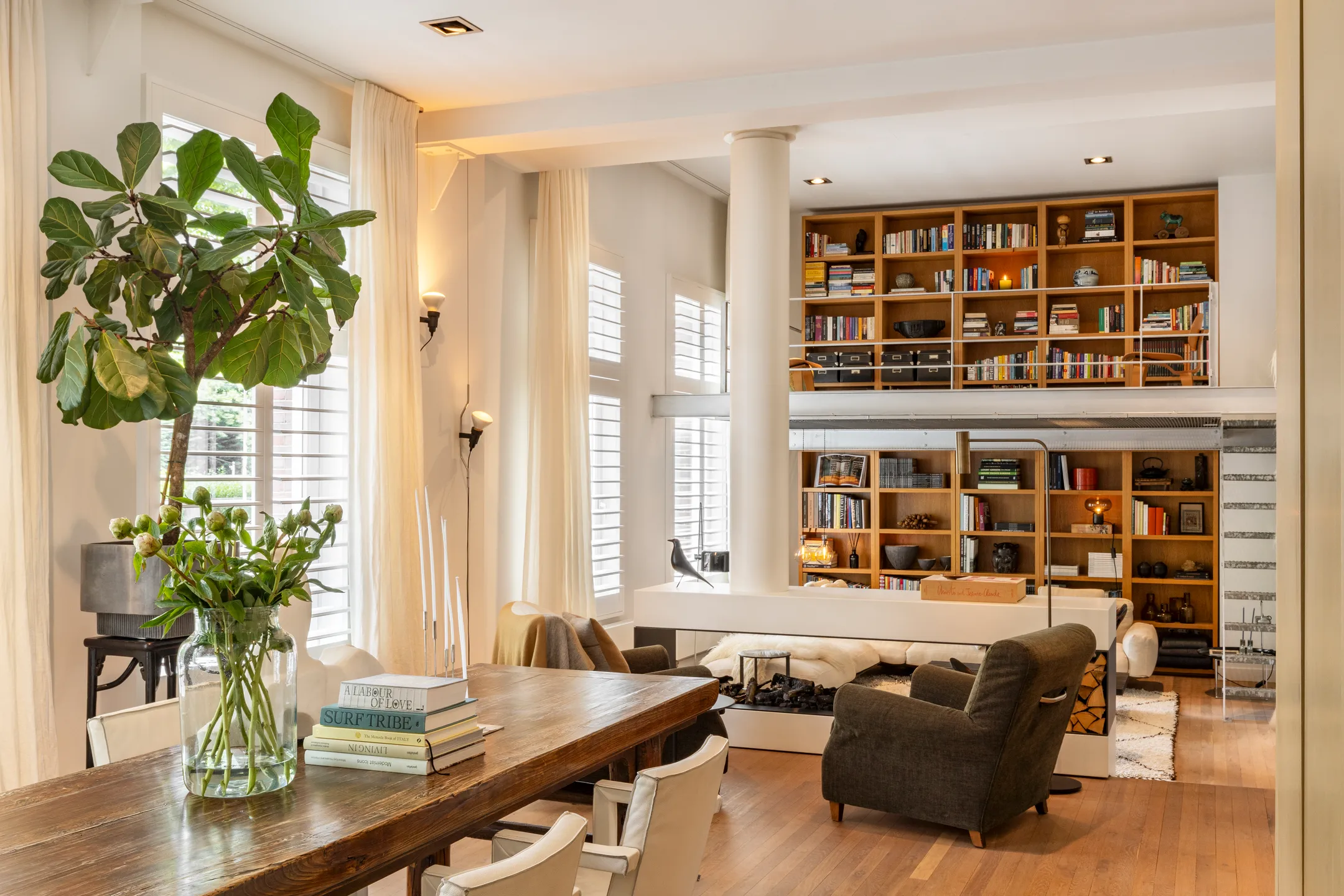 living room with designer fireplace 191sqm duplex apartment contemporary decor Amsterdam