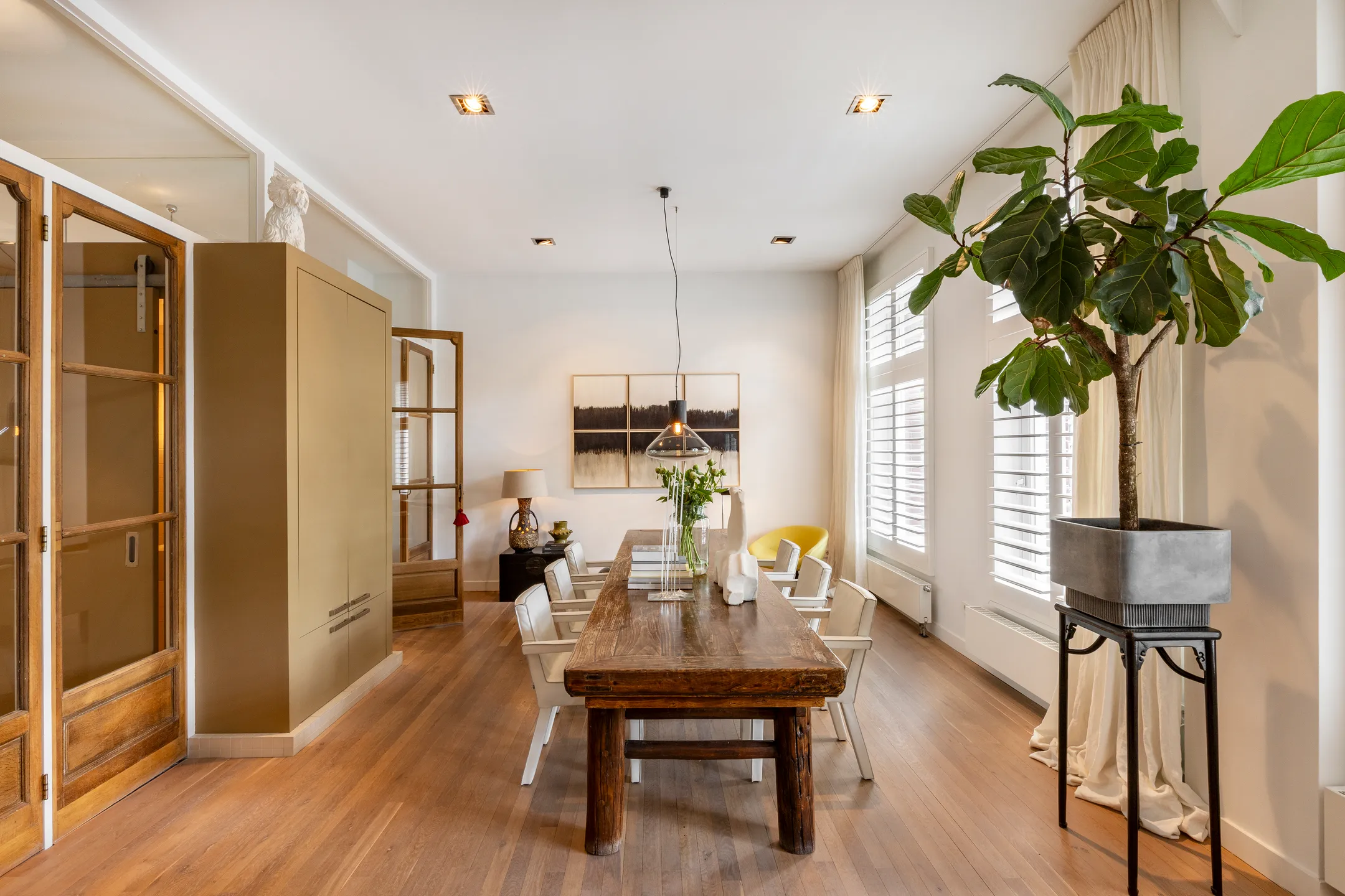 dining room with designer fireplace 191sqm duplex apartment contemporary decor Amsterdam