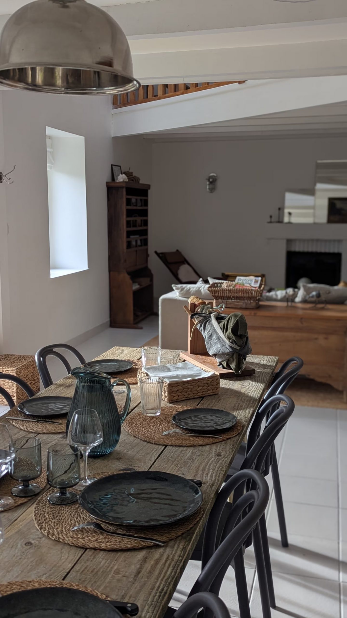 dining room and living room with fireplace neutral rustic chic decor house near the sea Brittany Ker Darwin Paimpol