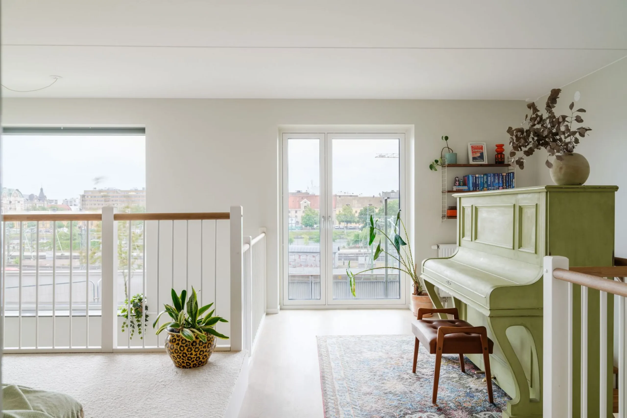 mezzanine with green historic piano