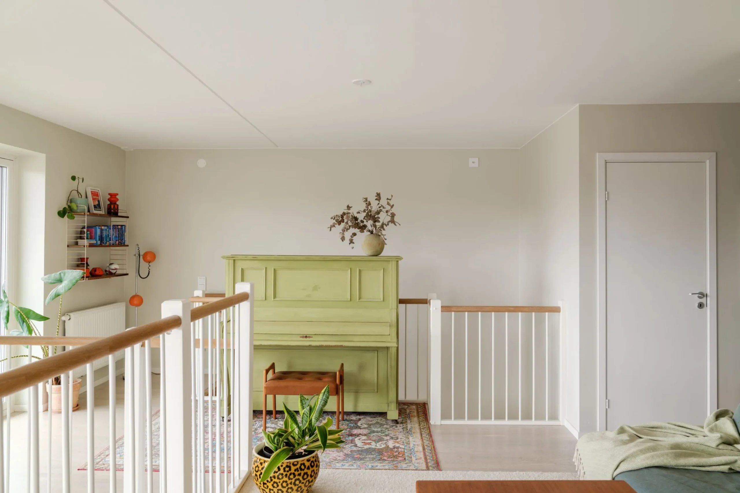 mezzanine with green historic piano