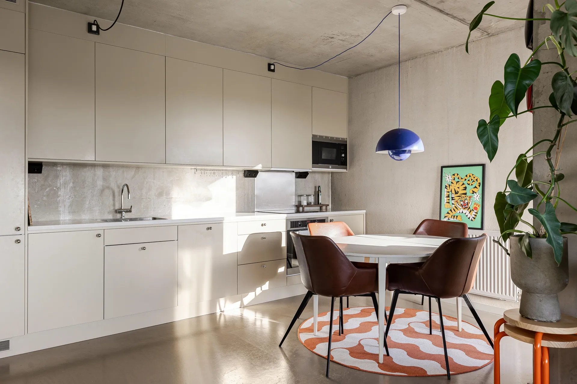 open white kitchen dining room with concrete floor walls and ceiling 48sqm two-room apartment Scandinavian decor