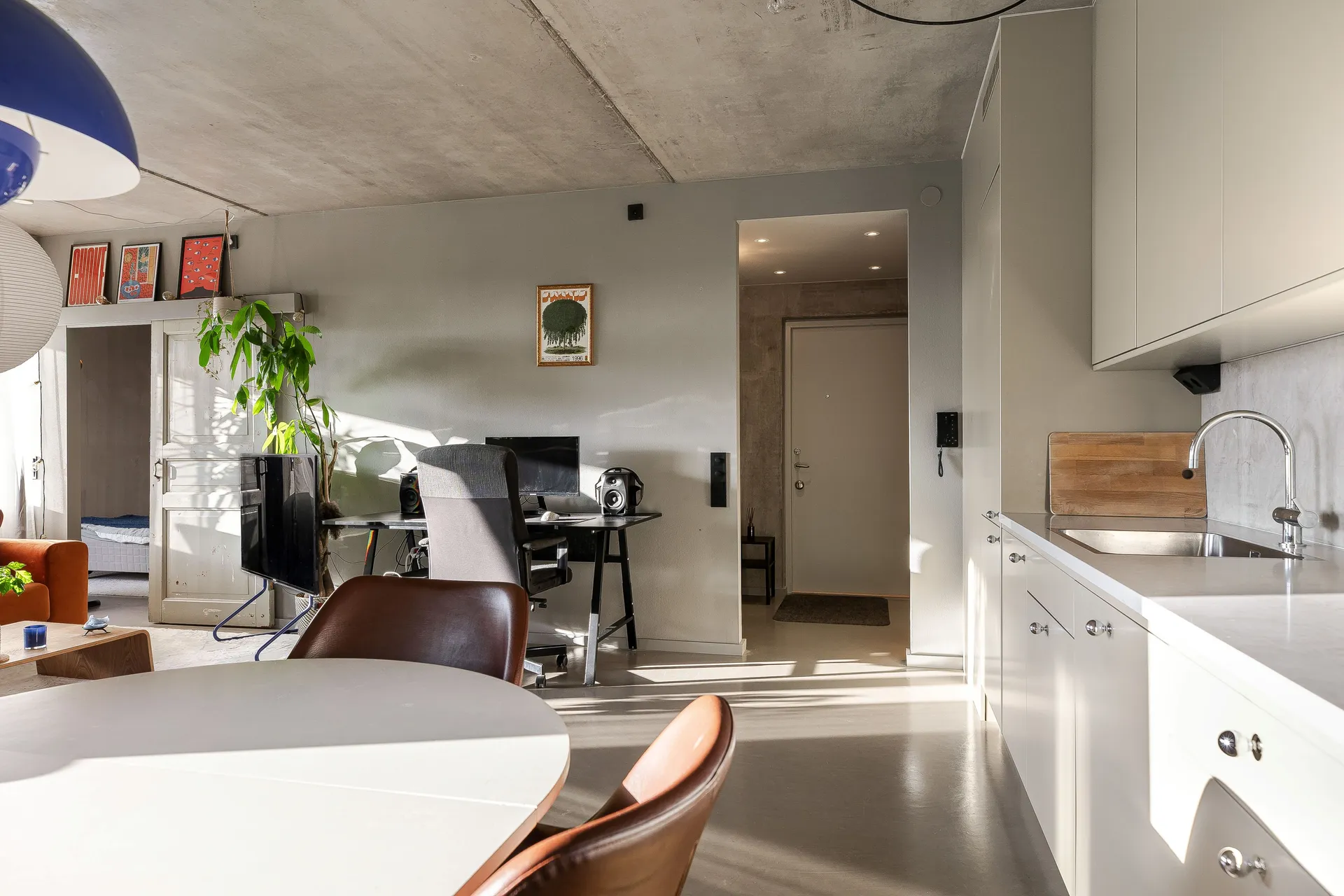 open white kitchen dining room and living room with concrete floor walls and ceiling 48sqm two-room apartment Scandinavian decor