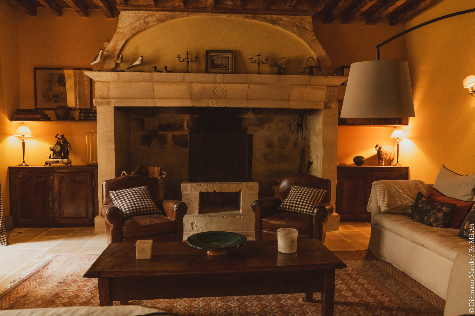 living room with beams and stone historic fireplace Provence