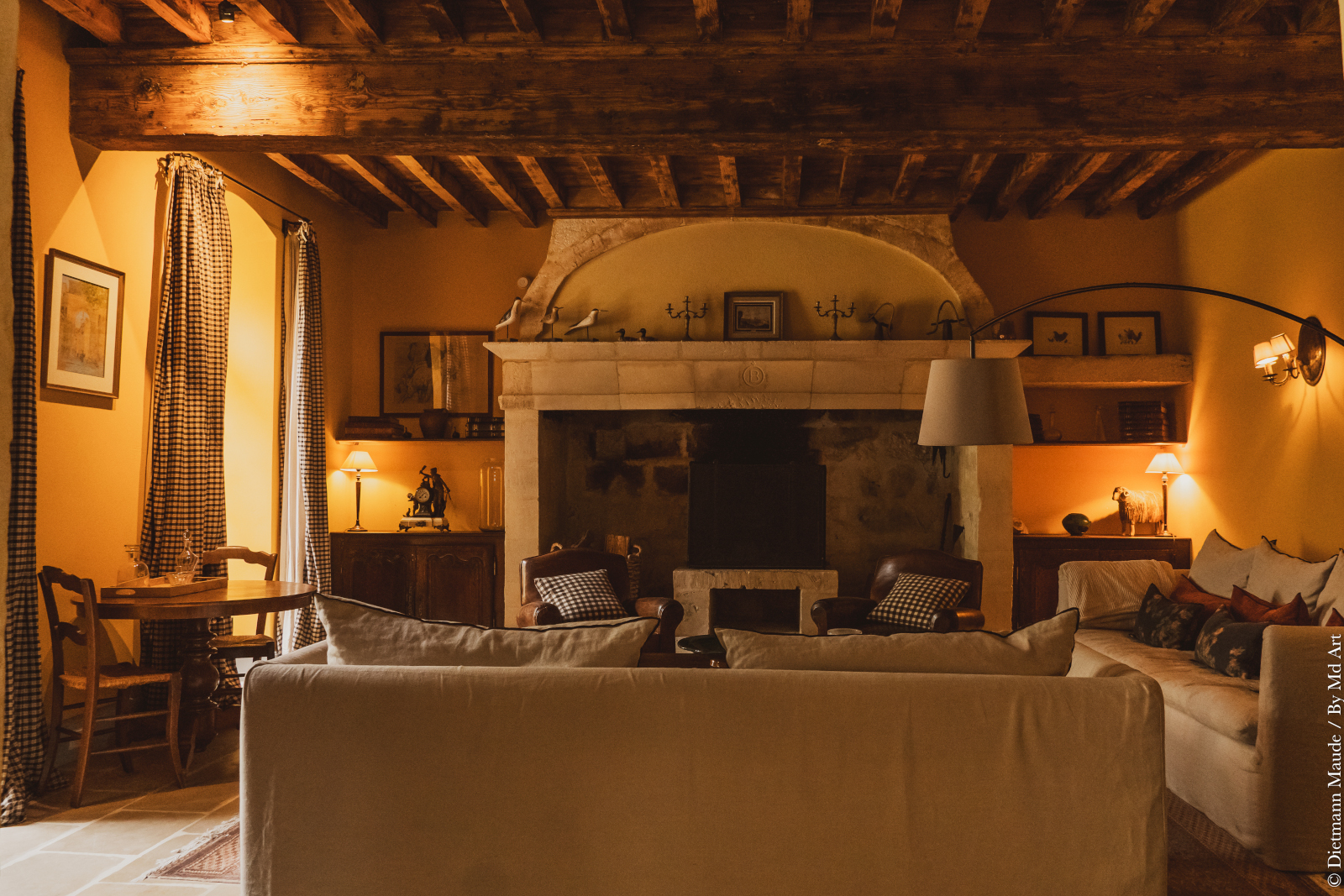 living room with beams and stone historic fireplace Provence