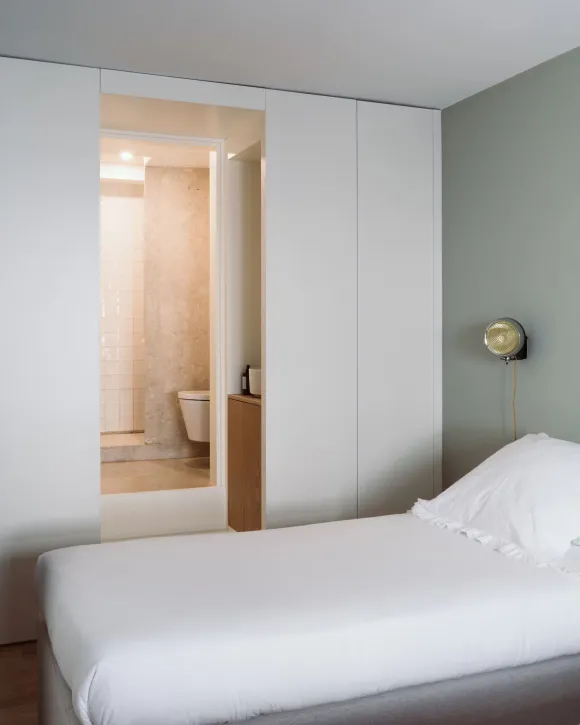 minimalist bedroom with bathroom period apartment in Lisbon