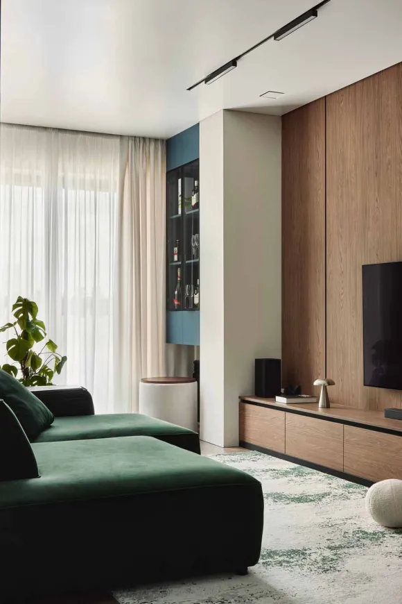 salon avec canapé vert en velours appartement 105m2 décoration contemporaine