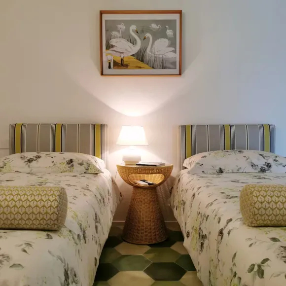 bedroom with beams green terracotta tiles floor 